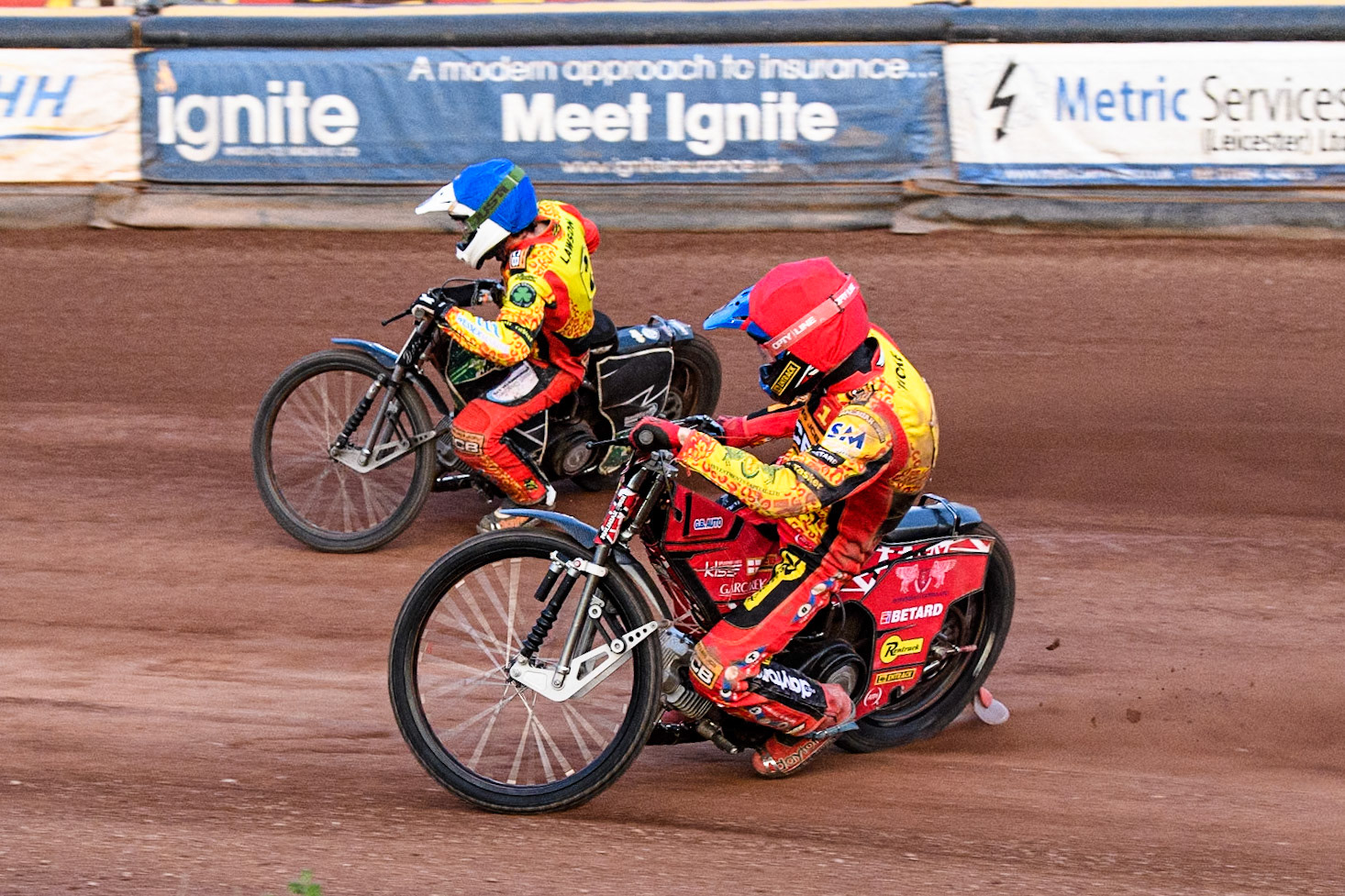 Leicester Lions' Max Fricke in Red rides inside Leicester Lions' Richard Lawson in Blue during the Rowe Motor Oil Premiership match between Leicester Lions and Belle Vue Aces at the Pidcock Motorcycles Arena, Leicester on Thursday 25th July 2024. (Photo: Ian Charles | MI News)