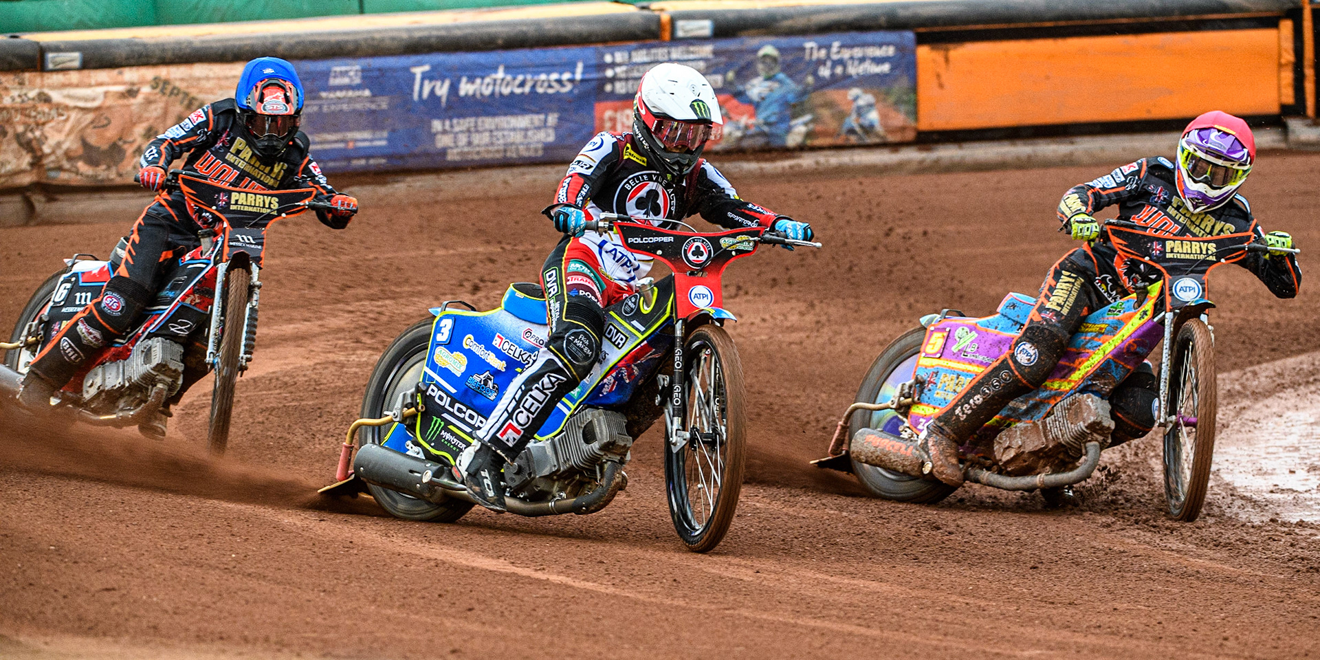 Jaimon Lidsey (White) outside Rory Schlein (Red) with Zach Cook (Blue) behind during the Sports Insure Premiership match between Wolverhampton Wolves and Belle Vue Aces at Monmore Green Stadium, Wolverhampton on Monday 10th July 2023. (Photo: Ian Charles | MI News)