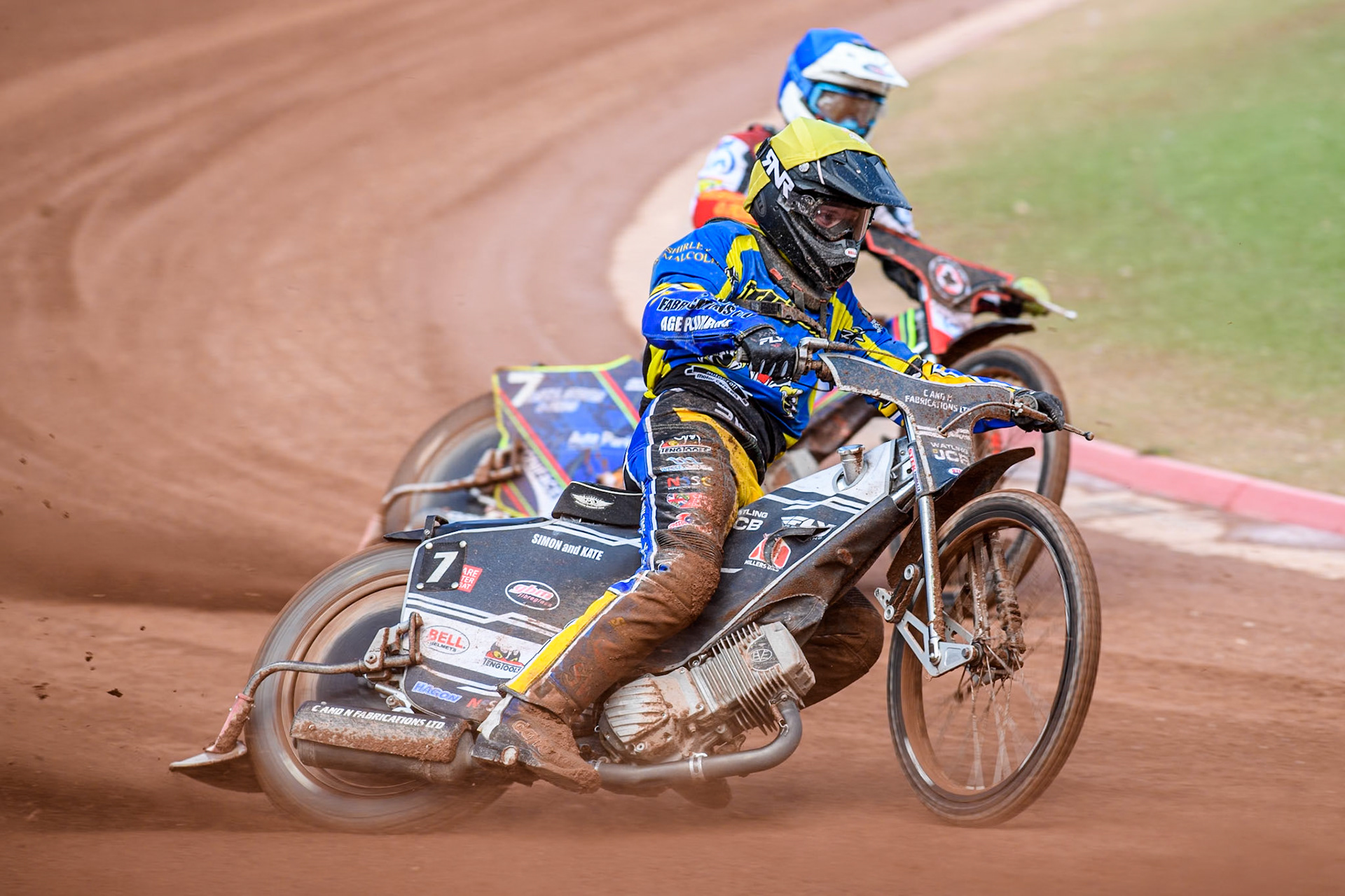 Sheffield Tigers' Guest Rider Joe Thompson  in Yellow rides outside Belle Vue Aces' Jake Mulford  in Blue during the Rowe Motor Oil Premiership match between Belle Vue Aces and Sheffield Tigers at the National Speedway Stadium, Manchester on Monday 26th August 2024. (Photo: Ian Charles | MI News)