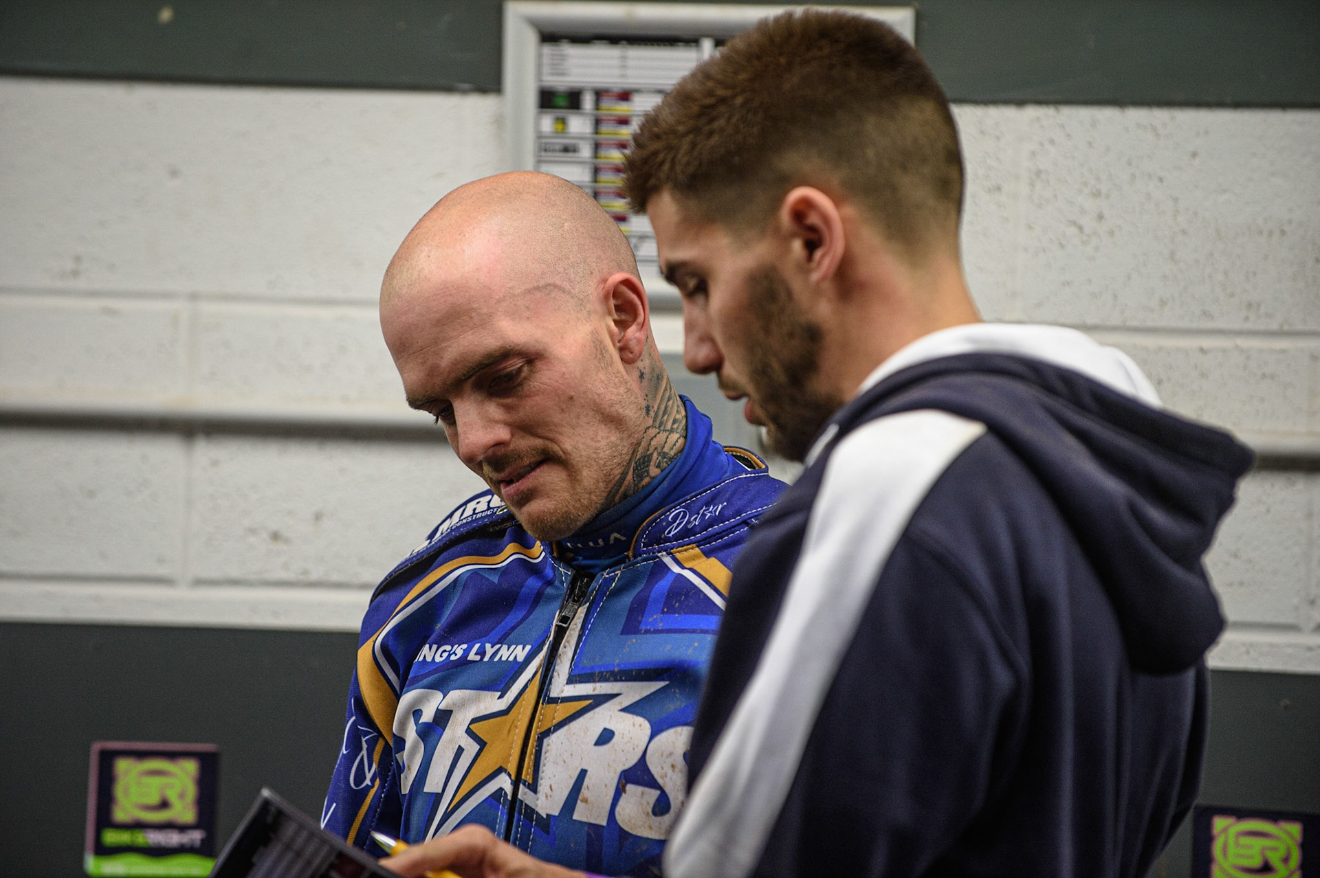 MANCHESTER, UK. AUGUST 23RD    King’s Lynn Minors &amp; Brady Stars  Manager Alex Brady  with Lewis Kerr  as they plan for the final heat during the SGB Premiership match between Belle Vue Aces and King's Lynn Stars at the National Speedway Stadium, Manchester on Monday 23rd August 2021. (Credit: Ian Charles | MI News)