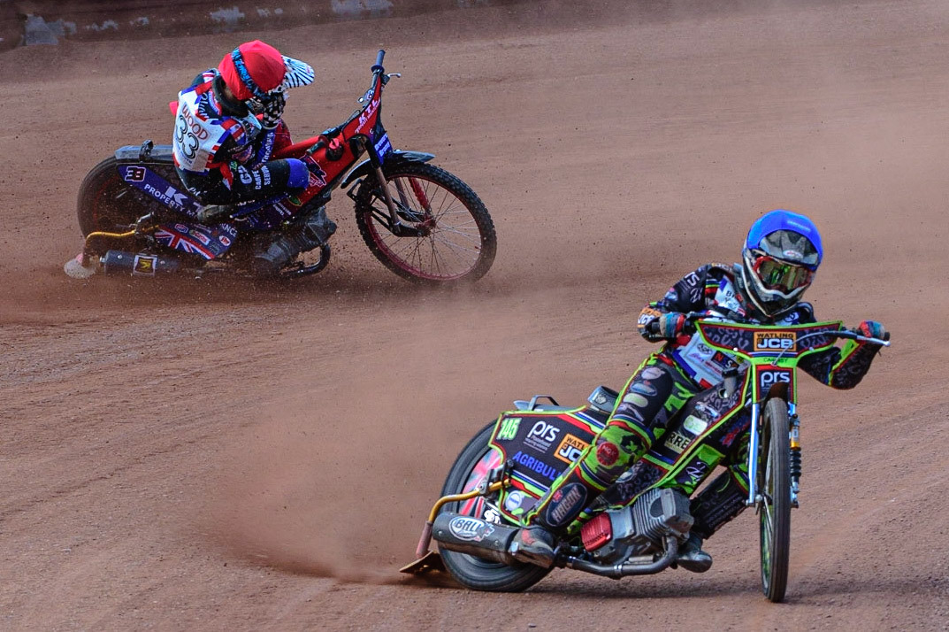 MANCHESTER, UK. JUN 3RD Charlie Wood (33) (Red) crashes behind William Cairns (145)  (Blue) during the British Youth Speedway Championship (Round 4)  at the National Speedway Stadium, Manchester on Friday 3rd June 2022. (Credit: Ian Charles | MI News)