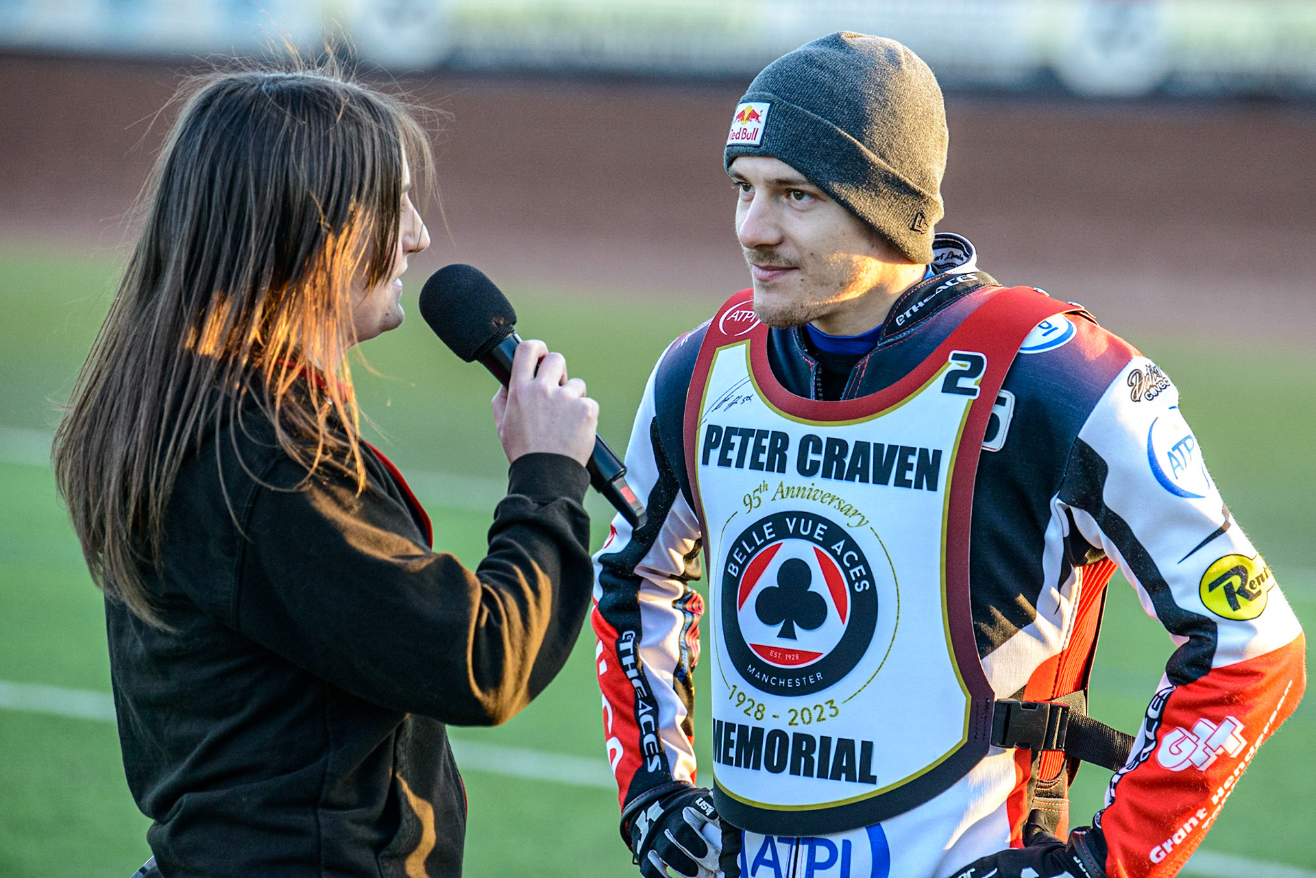 Robert Lambert (right)gives an interview to meeting presenter Hayley Bromley during the Peter Craven Memorial Trophy  at the National Speedway Stadium, Manchester on Monday 3rd April 2023. (Photo: Ian Charles | MI News)