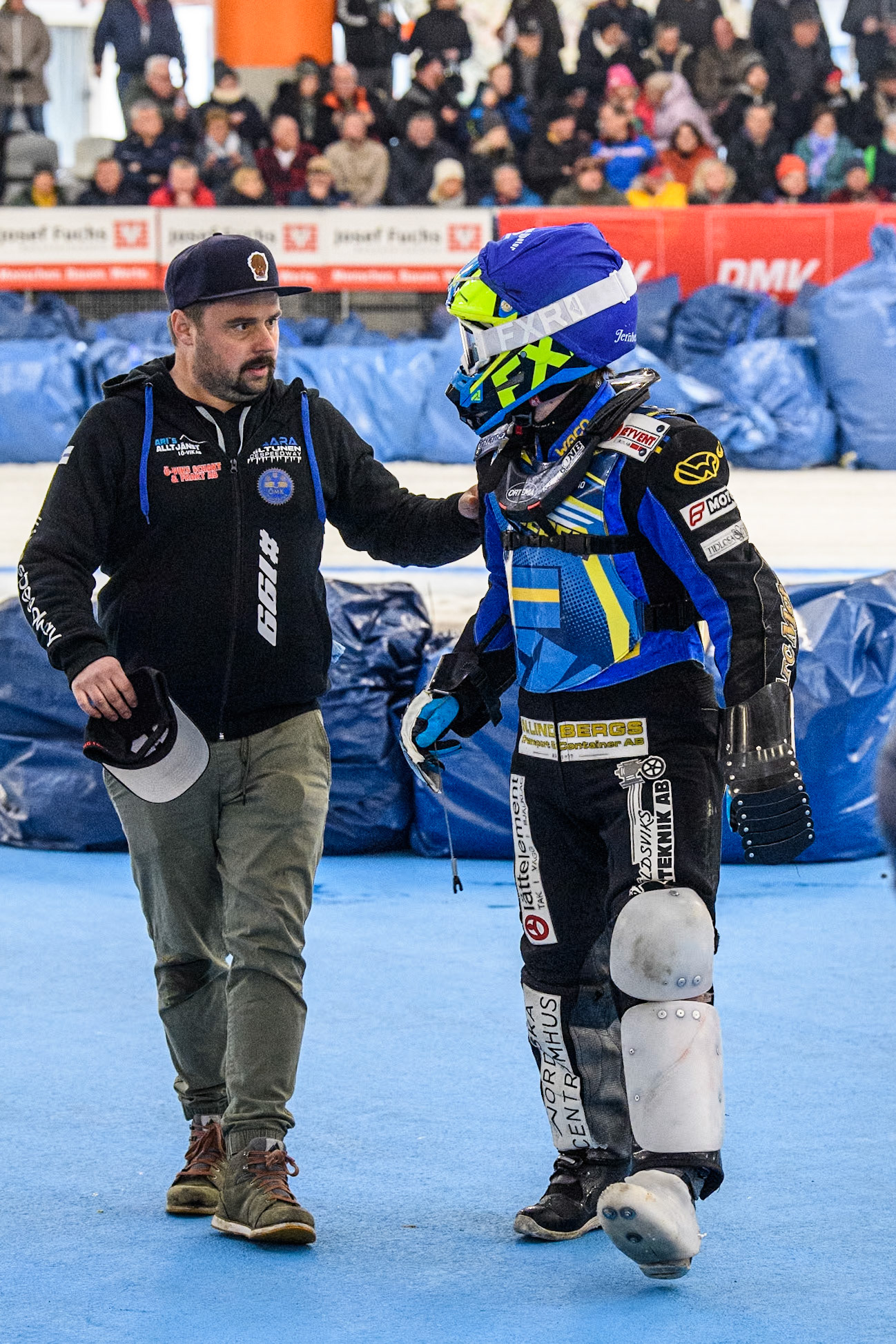 Sweden's Martin Haarahiltunen (199)  (Right) with his mechanic after his fall during the FIM Ice Speedway Gladiators World Championship Final 2 at the Max-Aicher-Arena, Inzell on Sunday 24 March 2024. (Photo: Ian Charles | MI News)