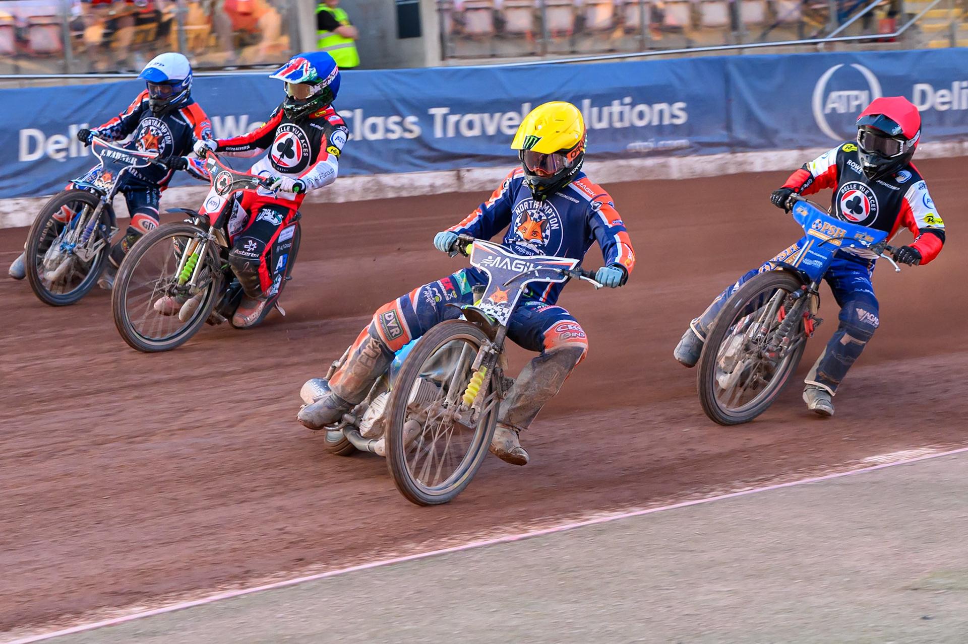 Jaimon Lidsey of Northampton Foxes  in Yellow leading Ben Cook, Guest Rider for Belle Vue Aces in Red ,Tate Zischke of Belle Vue Aces in Blue  and Matej Zagar of Northampton Foxes in White during the Rowe Motor Oil Premiership match between Belle Vue Aces and Northampton Foxes at the National Speedway Stadium, Manchester on Monday 13th July 2026. (Photo: Ian Charles | MI News)