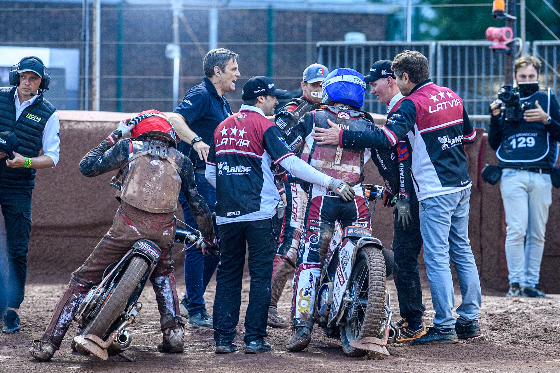 the Latvian riders are congratulated by their support team during the Monster Energy FIM Speedway of Nation Semi Final 2 at the National Speedway Stadium, Manchester on Wednesday 10th July 2024. (Photo: Ian Charles | MI News)