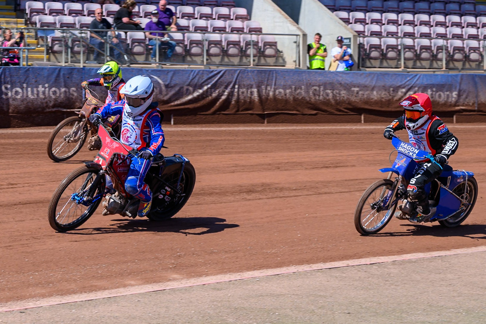 125cc SUPPORT CLASS Aston Knott (89) in White leading Jenson Braithwaite (16) in Red  and Seb Kelly (57) in Yellow during the British Youth Championship (125cc) at the National Speedway Stadium, Manchester on Sunday 19th July 2026. (Photo: Ian Charles | MI News)
