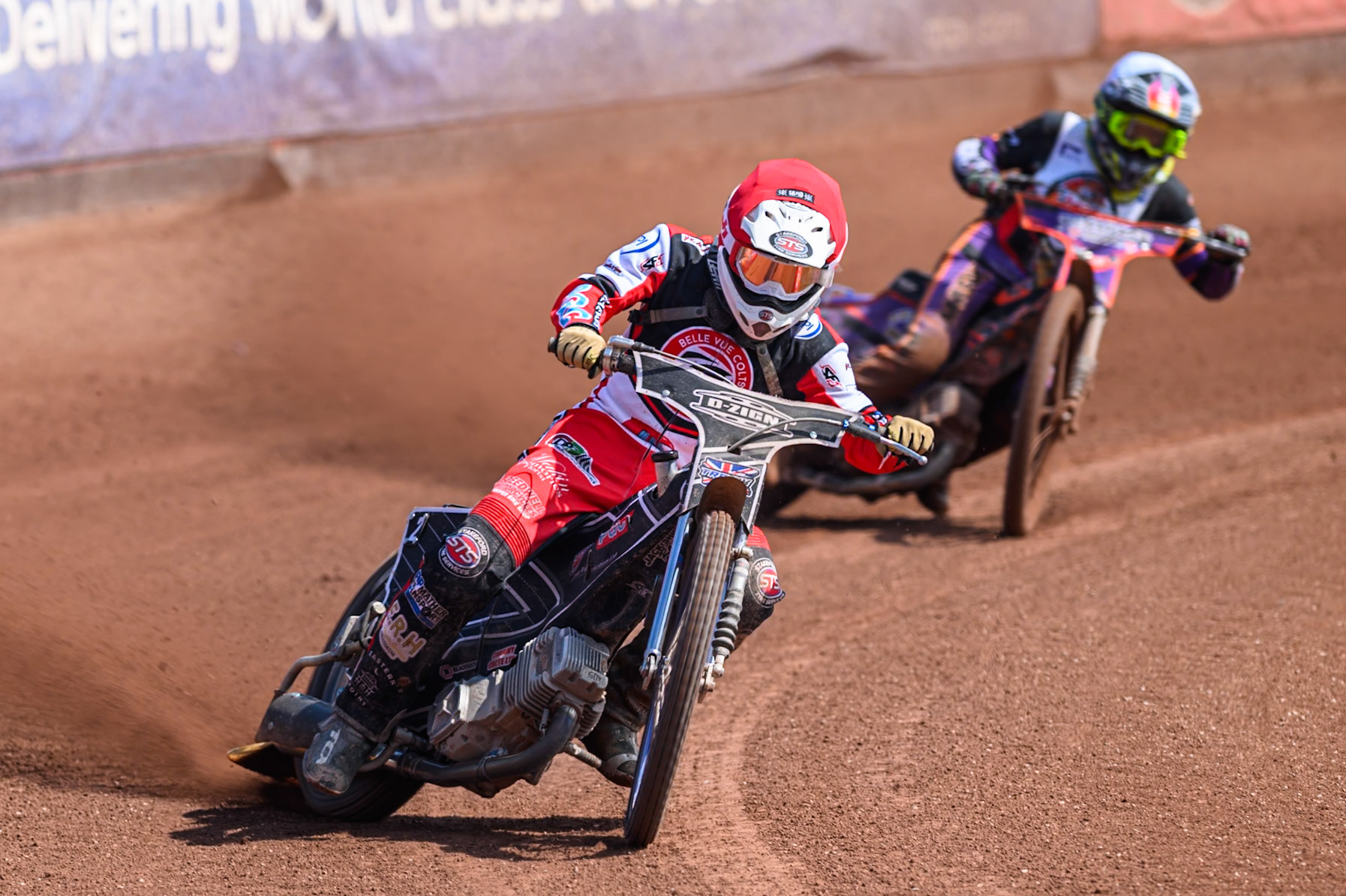 Jack Shimelt of Belle Vue Colts   in Red leading Elliot Kelly of Middlesborough Tigers  in White during the WSRA National Development League match between Belle Vue Colts and Middlesbrough Tigers at the National Speedway Stadium, Manchester on Sunday 10th August 2025. (Photo: Mark Fletcher | MI News)