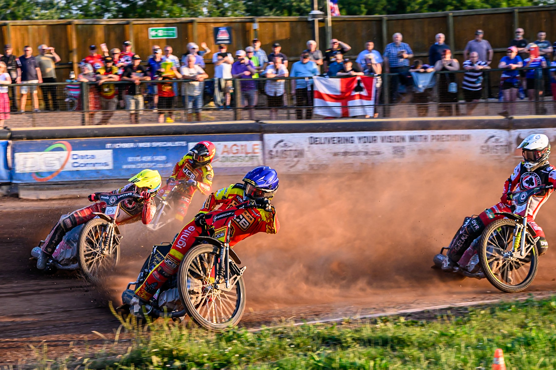 Belle Vue Aces' Dan Bewley in Yellow rides outside Leicester Lions' Kyle Howarth in Blue with Belle Vue Aces' Jaimon Lidsey in White and Leicester Lions' Ryan Douglas in Red behind during the Rowe Motor Oil Premiership match between Leicester Lions and Belle Vue Aces at the Hydroscand Arena, Leicester on Thursday 19th June 2025. (Photo: Ian Charles | MI News)