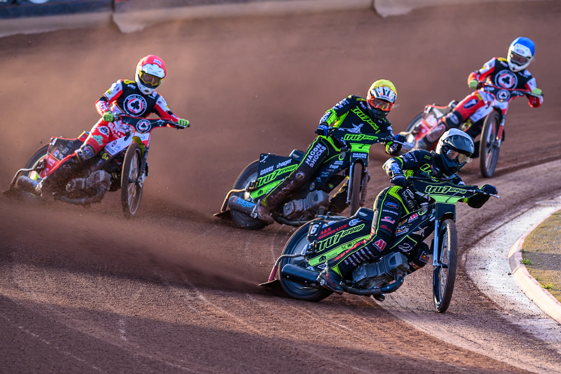 Dan Thompson of Ipswich Witches in White leading Jason Edwards of Ipswich Witches  in Yellow, Tate Zischke of Belle Vue Aces  in Red and Jake Mulford of Belle Vue Aces  in Blue during the Rowe Motor Oil Premiership match between Belle Vue Aces and Ipswich Witches at the National Speedway Stadium, Manchester on Monday 4th August 2025. (Photo: Ian Charles | MI News)