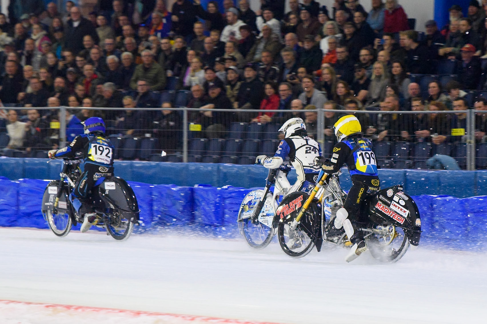 Martin Haarahiltunen (199) of Sweden in Yellow chases Max Koivula (24) of Finland in White, and Niclas Svensson (192) of Sweden in Blue during the FIM Ice Speedway Gladiators World Championship, Final 3 at the Ice Stadium, Thialf, Heerenveen on Saturday 5th April 2025. (Photo: Ian Charles | MI News)