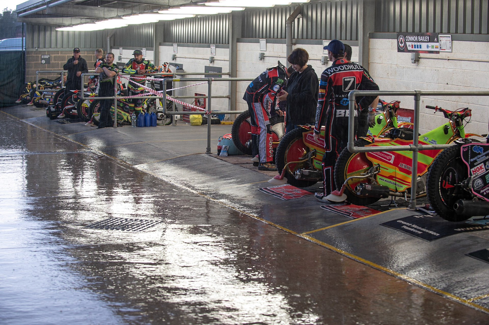 Photo: Ian Charles

Riders shelter from the rain after a downpour before the meeting

Belle Vue Colts v Kent Kings, SGB National League, Belle Vue National Speedway Stadium, Manchester, Thursday 1  August  2019
