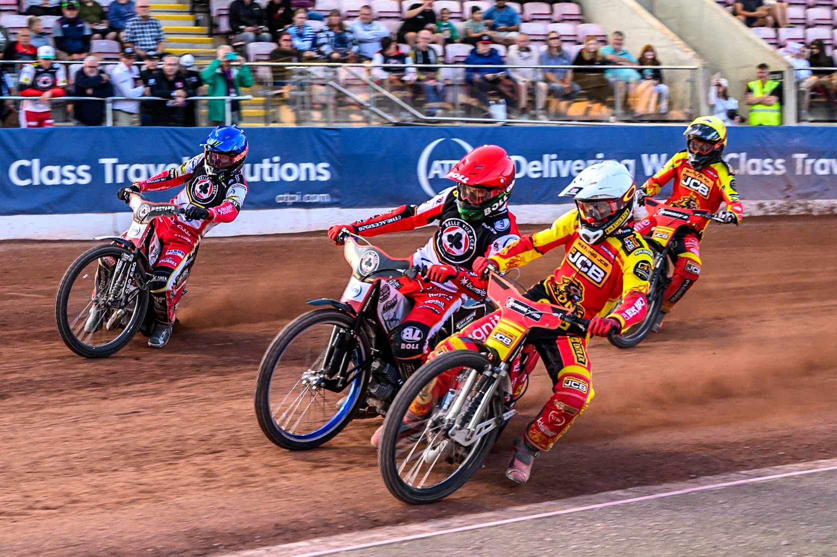 Leicester Lions' Max Fricke  in White on the inside of Belle Vue Aces' Brady Kurtz in Red and Belle Vue Aces' Dan Bewley in Blue with Leicester Lions' Sam Masters  in Yellow behind during the Rowe Motor Oil Premiership match between Belle Vue Aces and Leicester Lions at the National Speedway Stadium, Manchester on Monday 14th July 2025. (Photo: Ian Charles | MI News)
