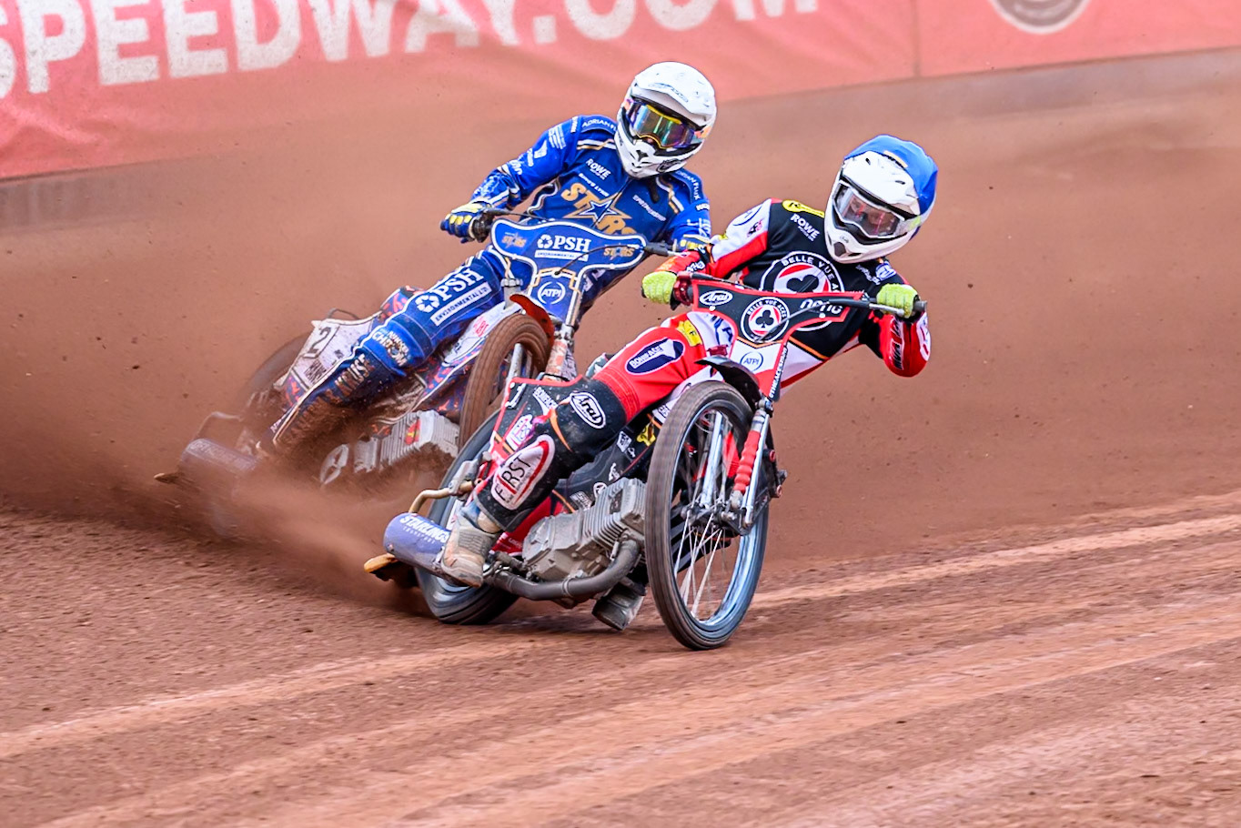 Belle Vue Aces' Jake Mulford in Blue leading Kings Lynn Stars' Niels-Kristian Iversen in White during the Rowe Motor Oil Premiership match between Belle Vue Aces and King's Lynn Stars at the National Speedway Stadium, Manchester on Monday 23rd June 2025. (Photo: Ian Charles | MI News)