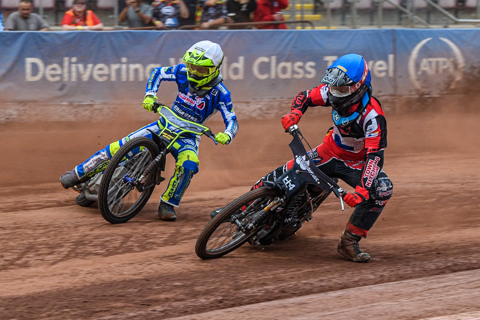 Belle Vue Colts' Harry McGurk  in Blue starts to pull up with mechanical problems inside  Oxford Chargers' Jacob Clouting  in White during the WSRA National Development League match between Belle Vue Colts and Oxford Chargers at the National Speedway Stadium, Manchester on Friday 2nd August 2024. (Photo: Ian Charles | MI News)