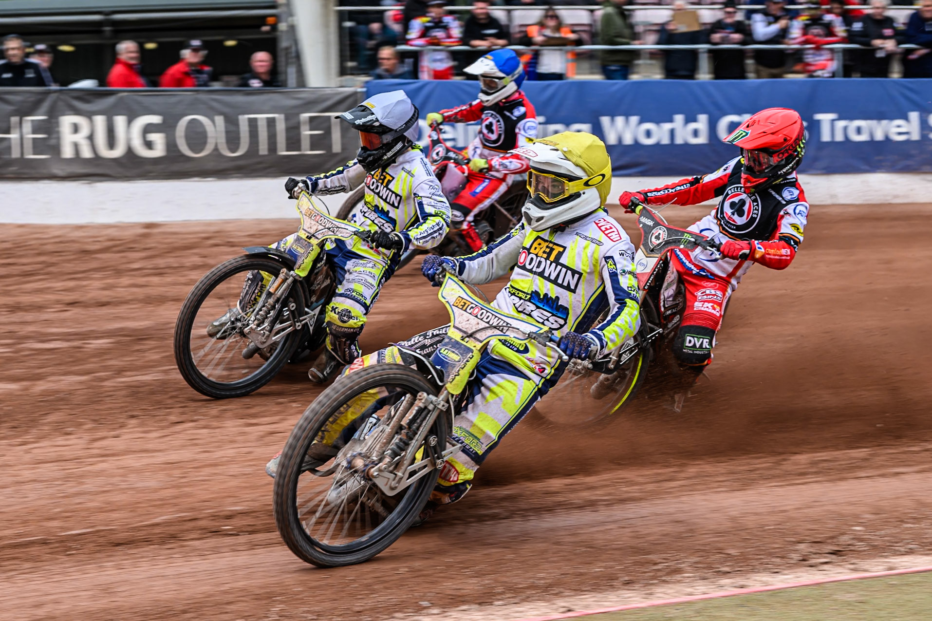 Oxford Spires' Peter Kildemand in Yellow rides inside Belle Vue Aces' Jaimon Lidsey in Red, Oxford Spires' Erik Riss in White and Belle Vue Aces' Jake Mulford in Blue during the Rowe Motor Oil Premiership match between Belle Vue Aces and Oxford Spires at the National Speedway Stadium, Manchester on Monday 26th May 2025. (Photo: Ian Charles | MI News)