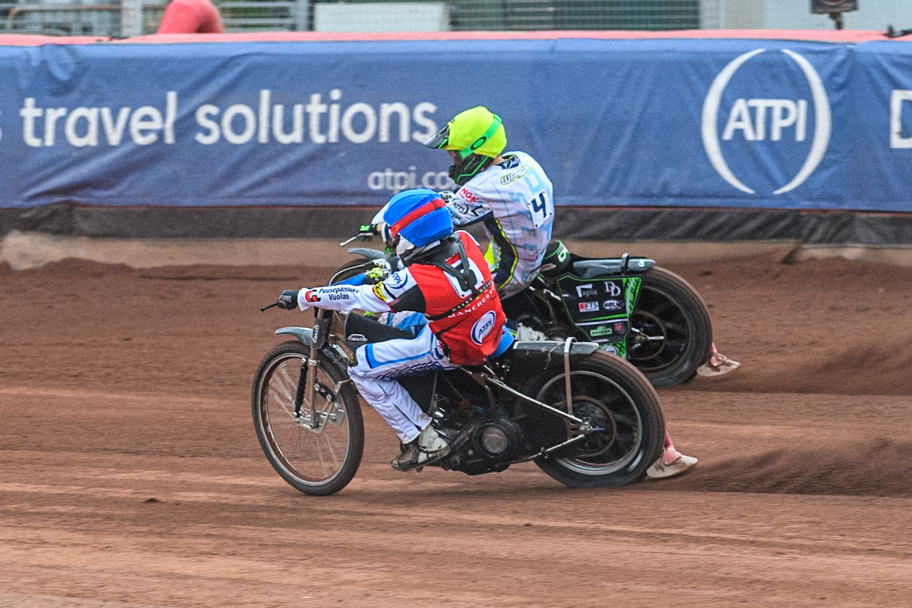 Belle Vue Aces' guest Antti Vuolas  in Blue rides inside Oxford Spires' Charles Wright  in Yellow during the Rowe Motor Oil Premiership match between Belle Vue Aces and Oxford Spires at the National Speedway Stadium, Manchester on Monday 22nd July 2024. (Photo: Ian Charles | MI News)