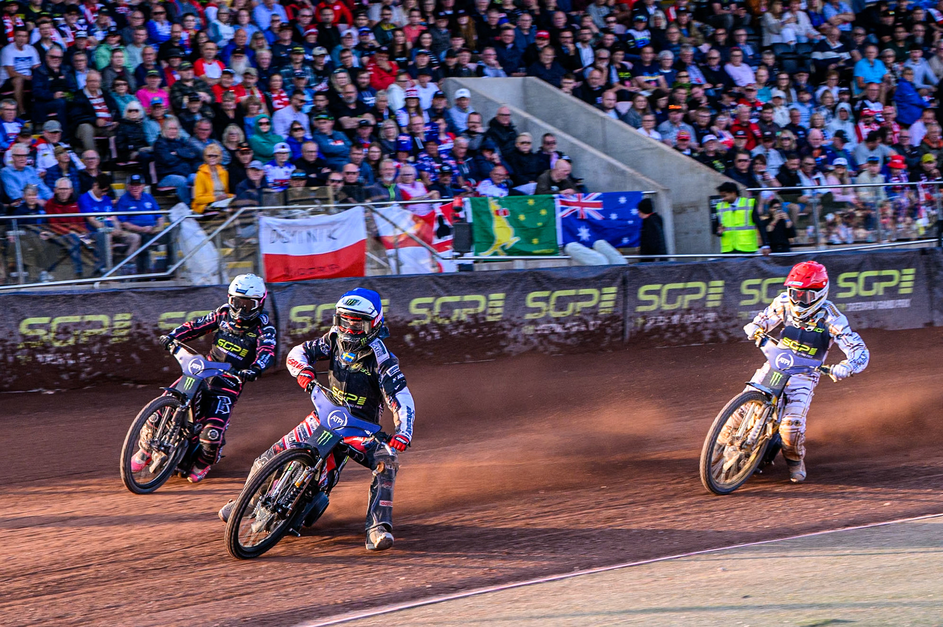 Re-Run of Heat 15: Fredrik Lindgren (66) of Sweden in Blue leading Kai Huckenbeck (744) of Germany in White and Anders Thomsen (105) of Denmark in Red during the ATPI FIM Speedway Grand Prix Round 5 at the National Speedway Stadium, Manchester, on Saturday 14th June 2025. (Photo: Ian Charles | MI News)