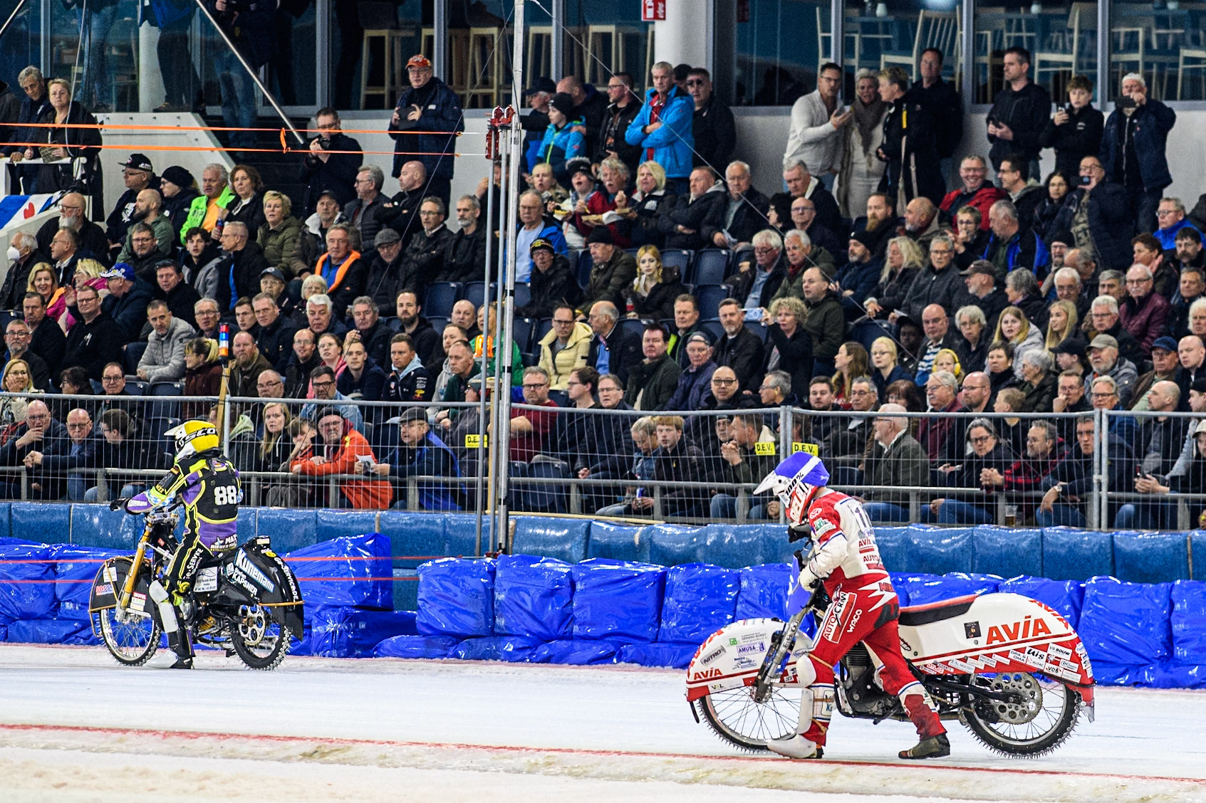 Wild Card Niek Schaap (16) of The Netherlands pushes his bike from the track after it fails at the start of Heat 13 during the FIM Ice Speedway Gladiators World Championship, Final 4 at the Ice Stadium, Thialf, Heerenveen on Sunday 6th April 2025. (Photo: Ian Charles | MI News)