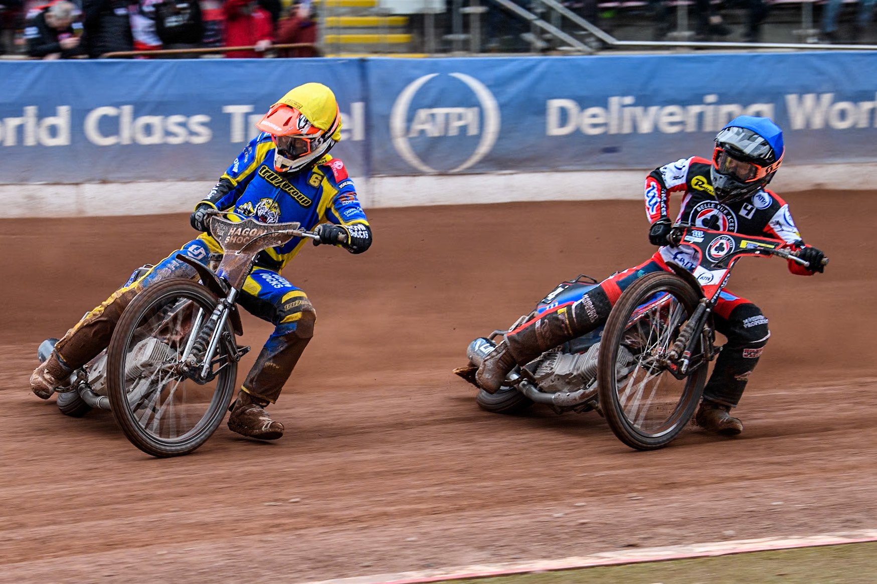 Sheffield Tigers' Jason Edwards (Yellow) leads  Belle Vue ATPI Aces Ben Cook (Blue) during the Rowe Motor Oil Premiership KO Cup Quarter Final 1st Leg between Belle Vue Aces and Sheffield Tigers at the National Speedway Stadium, Manchester on Monday 1st April 2024. (Photo: Ian Charles | MI News)
