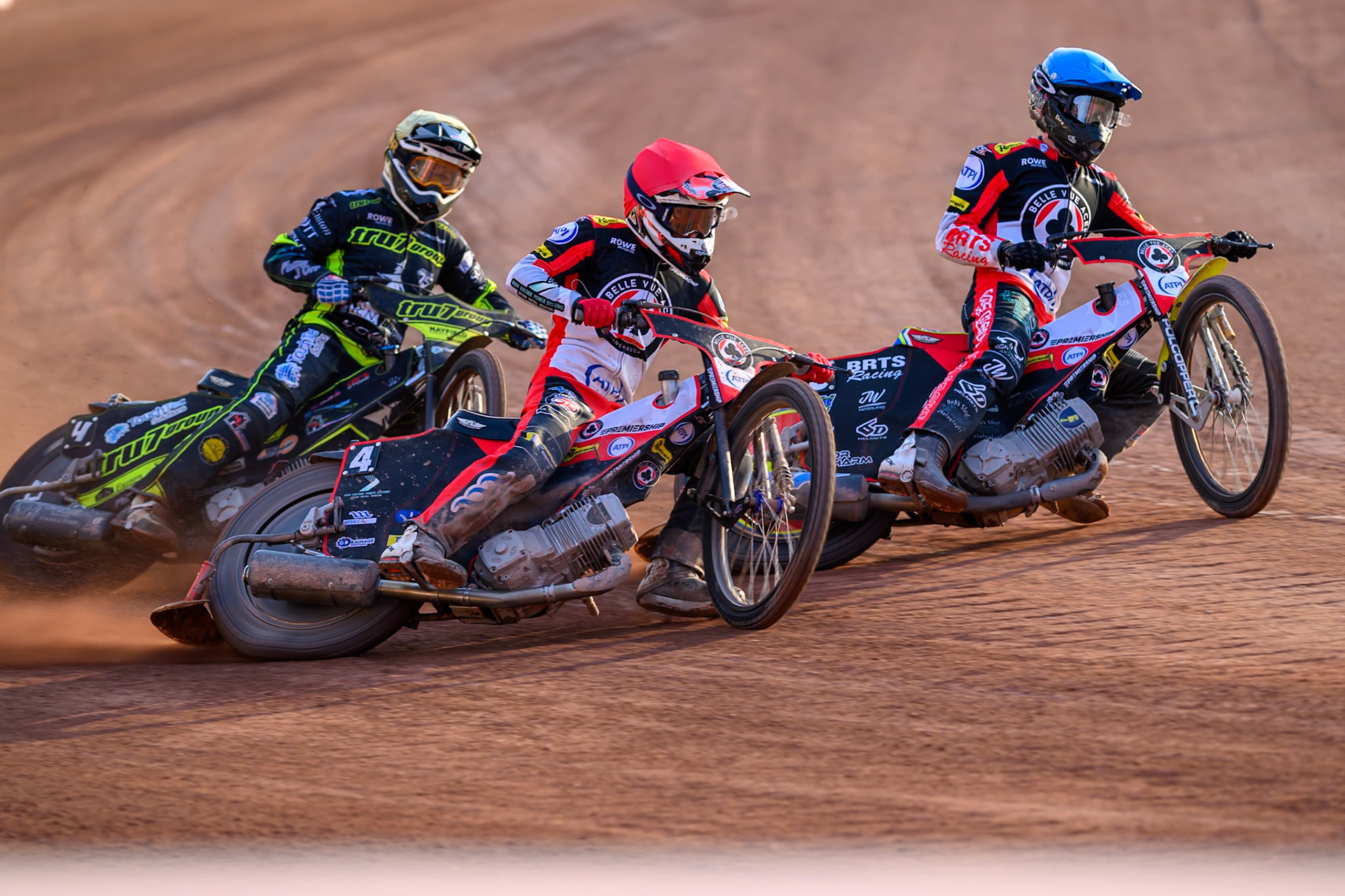 Zach Cook of Belle Vue Aces in Red and Tate Zischke of Belle Vue Aces in Blue leading Scott Nichols of Ipswich Witches in Yellow during the Rowe Motor Oil Premiership match between Belle Vue Aces and Ipswich Witches at the National Speedway Stadium, Manchester on Saturday 20th June 2026. (Photo: Ian Charles | MI News)