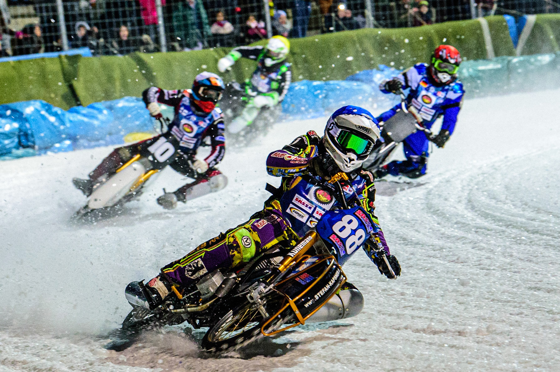 Max Neidermaier (Blue) leads Topi Mustonen (White) Reinhard Greisel (Red) and Finn Loheider (Yellow) during the German Individual Ice Speedway Championship at Horst-Dohm-Eisstadion, Berlin on Friday 3rd March 2023. (Photo: Ian Charles | MI News)