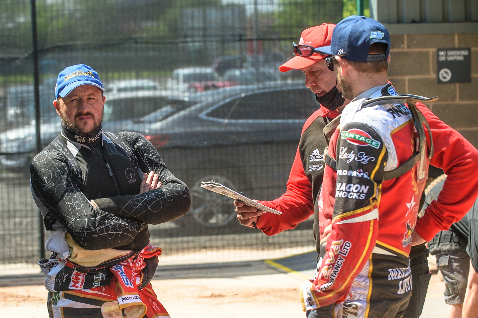 MANCHESTER, UK. MAY 31ST  Chris Harris  (left) and Scott Nicholls  (right) discuss tactics with Tram Manager Rob Lyon during the SGB Premiership match between Belle Vue Aces and Peterborough at the National Speedway Stadium, Manchester on Monday 31st May 2021. (Credit: Ian Charles | MI News)