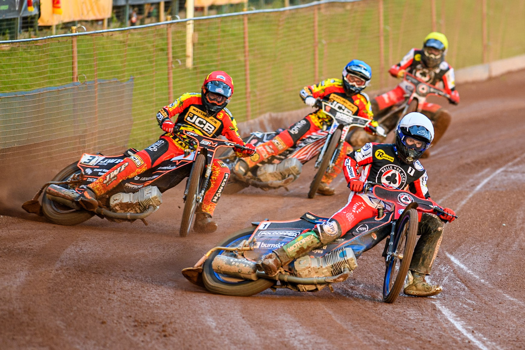 Belle Vue Aces' Brady Kurtz in White leading Leicester Lions' Sam Masters in Red, Leicester Lions' Luke Becker in Blue and Belle Vue Aces' Norick Blodorn in Yellow during the Rowe Motor Oil Premiership match between Leicester Lions and Belle Vue Aces at the Pidcock Motorcycles Arena, Leicester on Thursday 25th July 2024. (Photo: Ian Charles | MI News)