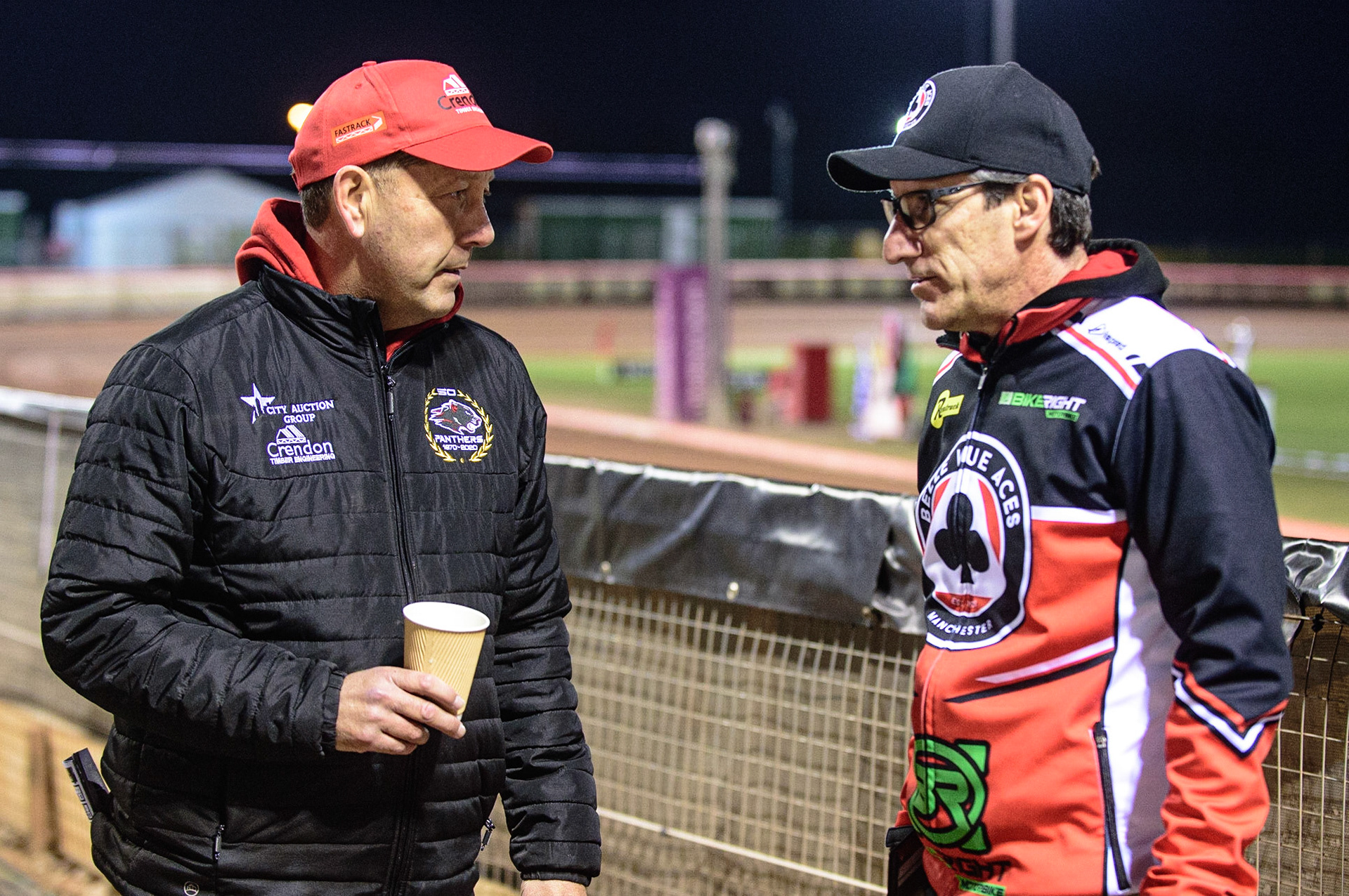 MANCHESTER, UK. OCT 11TH  Peterborough Crendon Panthers  Team Manager Rob Lyon (left) with Belle Vue BikeRight Aces  manager Mark Lemon  during the SGB Premiership Grand Final 1st Leg between Belle Vue Aces and Peterborough Panthers at the National Speedway Stadium, Manchester on Monday 11th October 2021. (Credit: Ian Charles | MI News)