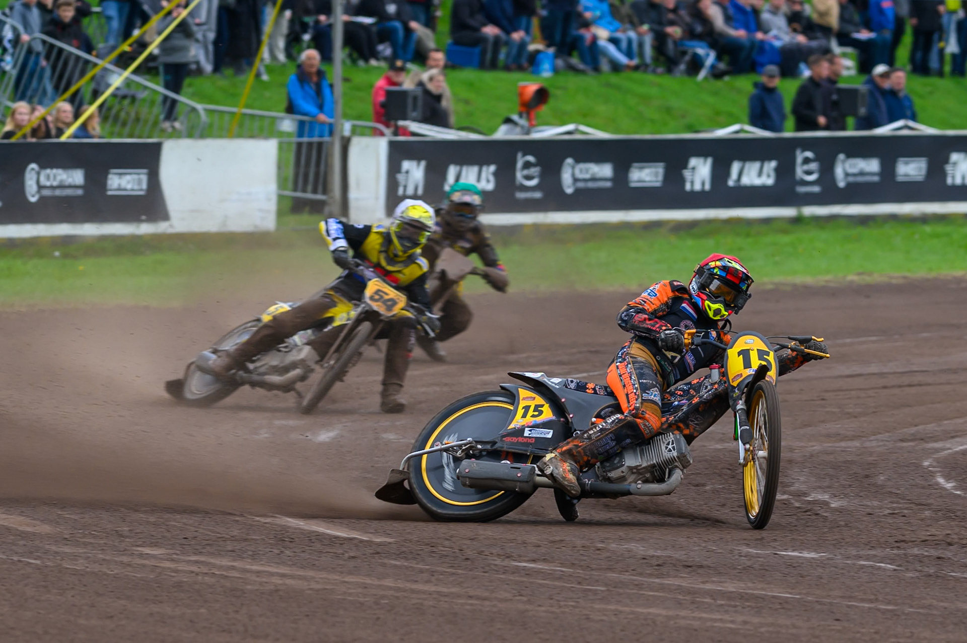 Wild Card Rider Romano Hummel (15) of The Netherlands in Red leading Mika Meijer (54) of The Netherlands in White and Tero Aarnio (44) of Finland in Green during the FIM Long Track World Championship Final 4, at the Speed Centre Roden, Netherlands on Sunday 21st September 2025. (Photo: Ian Charles | MI News)during the FIM Long Track World Championship Final 4, at the Speed Centre, Roden on Sunday 21st September 2025. (Photo: Ian Charles | MI News)
