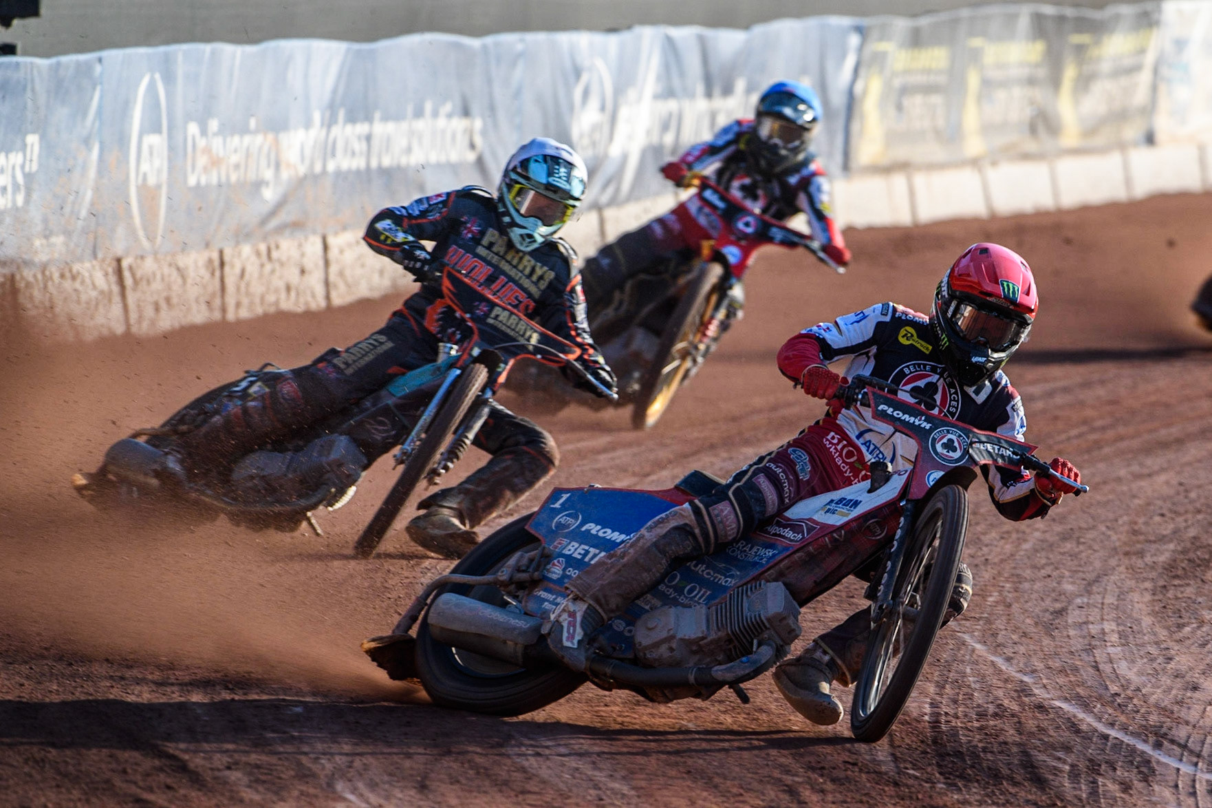 Dan Bewley (Red) leads Ryan Douglas (White) and Norick Blodorn (Blue) during the Sports Insure Premiership match between Belle Vue Aces and Wolverhampton Wolves at the National Speedway Stadium, Manchester on Monday 3rd July 2023. (Photo: Ian Charles | MI News)