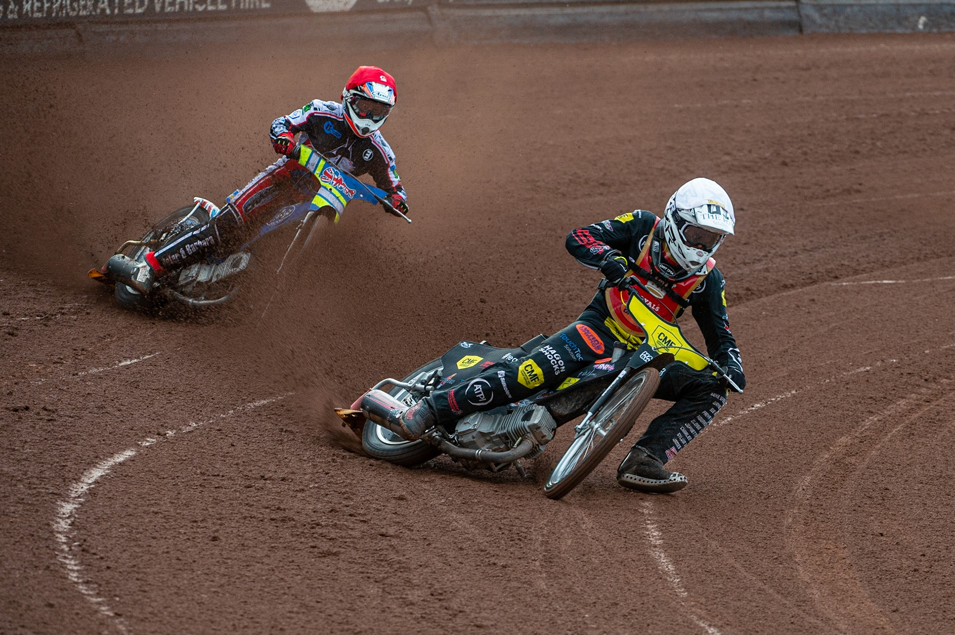 MANCHESTER, UK. JULY 2ND  Daniel Gilkes  (White) leads Benji Compton  (Red) during the National Development League match between Belle Vue Colts and Kent Royals at the National Speedway Stadium, Manchester on Friday 2nd July 2021. (Credit: Ian Charles | MI News)