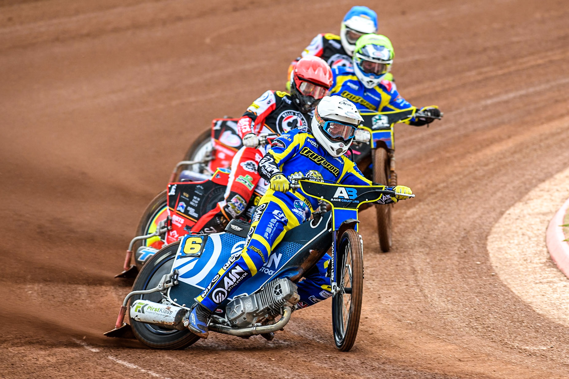 Lewis Kerr of Sheffield Tigers in White leading \bv6\ in Red, Leon Flint of Sheffield Tigers in Yellow and Jake Mulford of Belle Vue Aces in Blue during the Rowe Motor Oil Premiership match between Belle Vue Aces and Sheffield Tigers at the National Speedway Stadium, Manchester on Monday 5th May 2025. (Photo: Ian Charles | MI News)