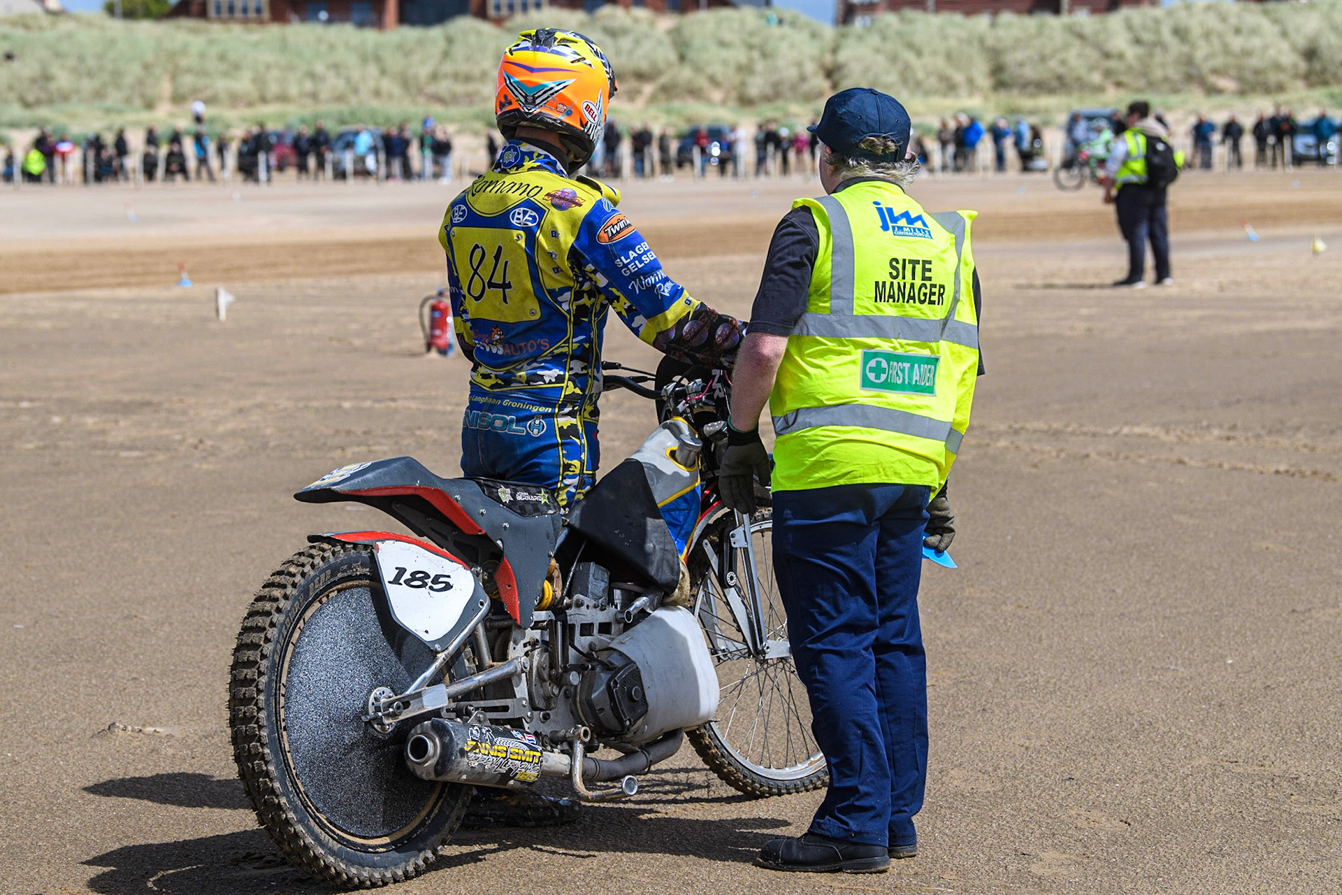 Dennis Smit (185) with one of the Marshall’s waiting for the recovery vehicle during the Fylde ACU British Sand Racing Masters Championship at  St Annes on Sea, Lancashire on Sunday 30th July 2023. (Photo: Ian Charles | MI News)