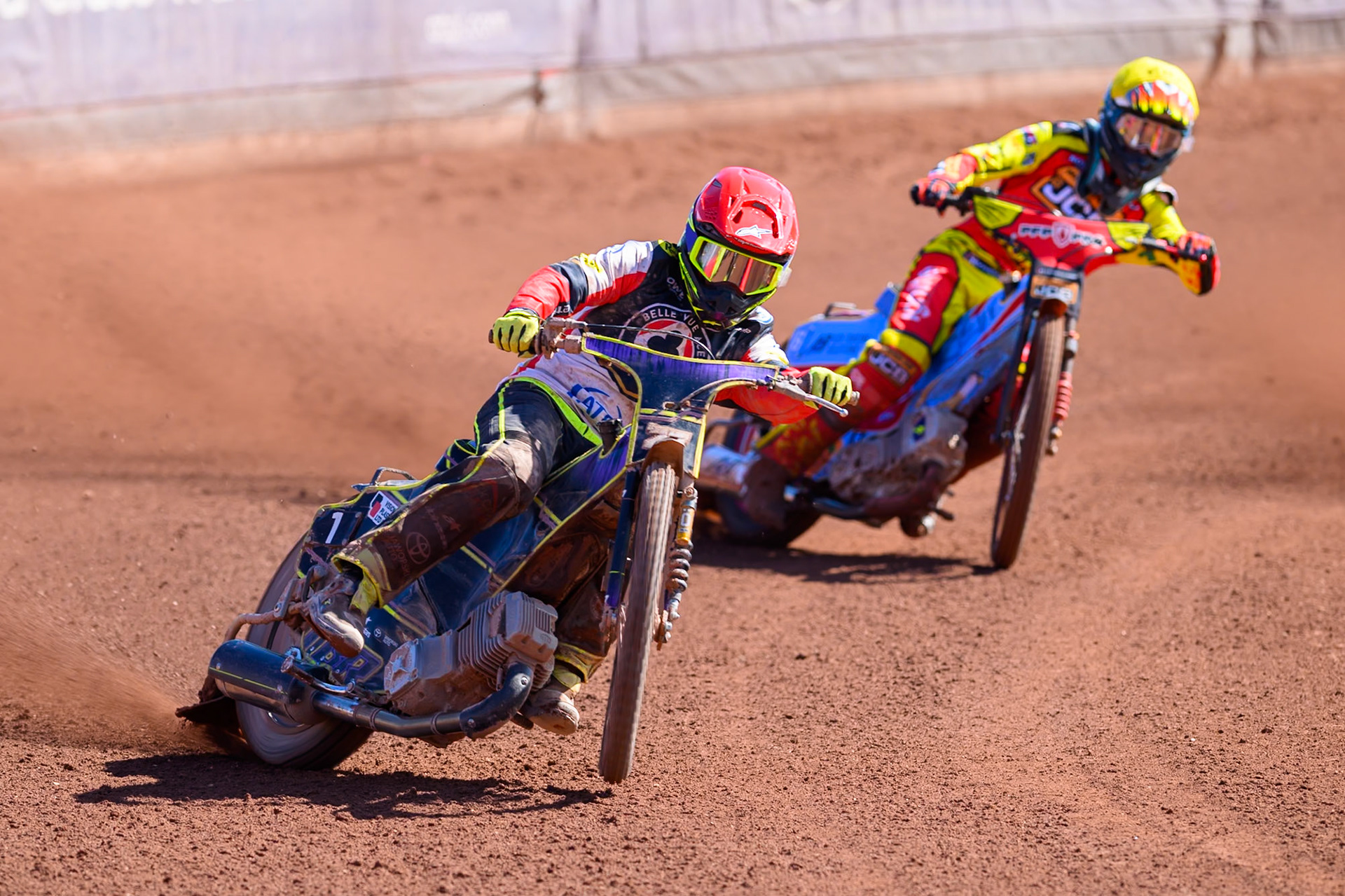 Tom Brennan Guest Rider for Belle Vue Aces  in Red leading Drew Kemp of Leicester Lions  in Yellow during the Knockout Cup Northern Section match between Belle Vue Aces and Leicester Lions at the National Speedway Stadium, Manchester on Monday 6th April 2026. (Photo: Ian Charles | MI News)