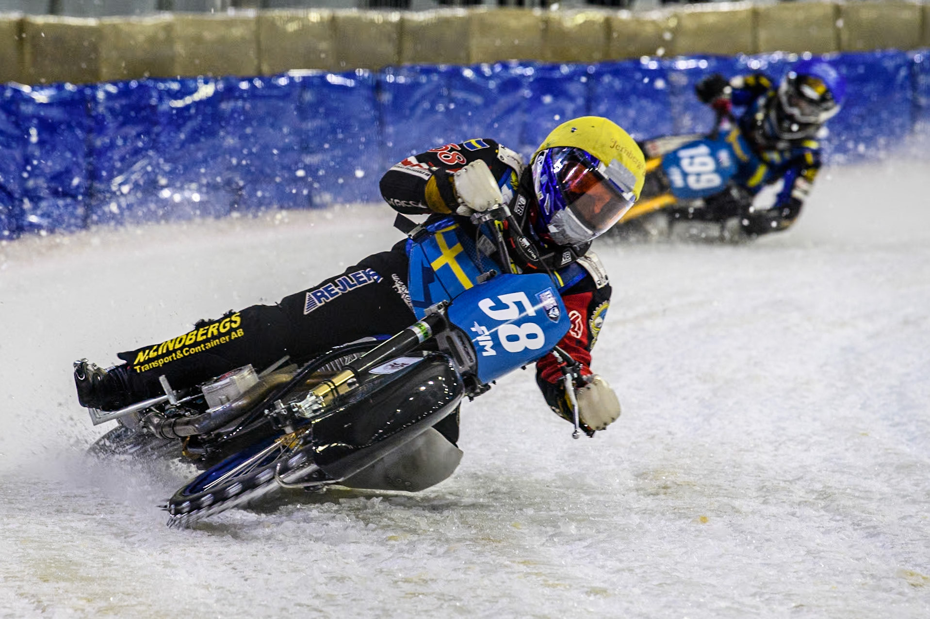 Sweden's Stefan Svensson (58) in Yellow leading Sweden's Martin Haarahiltunen (199)  during the FIM Ice Speedway Gladiators World Championship Final 4 at Ice Rink Thialf, Heerenveen on Sunday 7th April 2024. (Photo: Ian Charles | MI News)