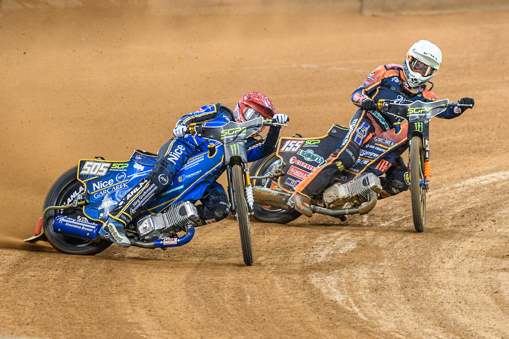 Robert Lambert (505) of Great Britain in Red leading Mikkel Michelsen (155) of Denmark in White during the FIM Speedway Grand Prix of Great Britain at The Principality Stadium, Cardiff on Saturday 17th August 2024. (Photo: Ian Charles | MI News)