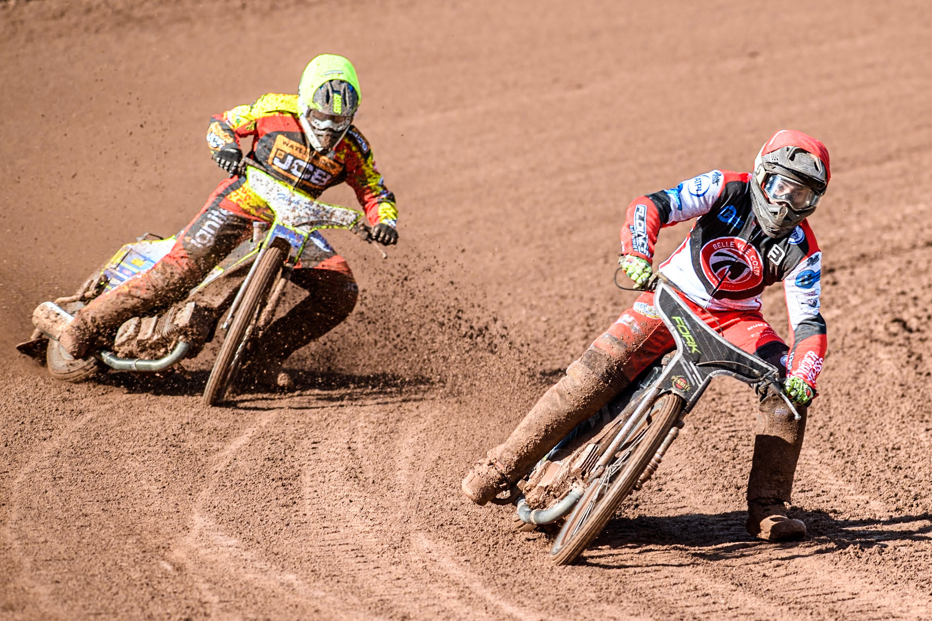Belle Vue Colts' Matt Marson (Red) has trouble on the track ahead of Leicester Lion Cubs' Arran Butcher (Yellow) during the WSRA  National Development League match between Belle Vue Colts and Leicester Lion Cubs at the National Speedway Stadium, Manchester on Friday 29th March 2024. (Photo: Ian Charles | MI News)