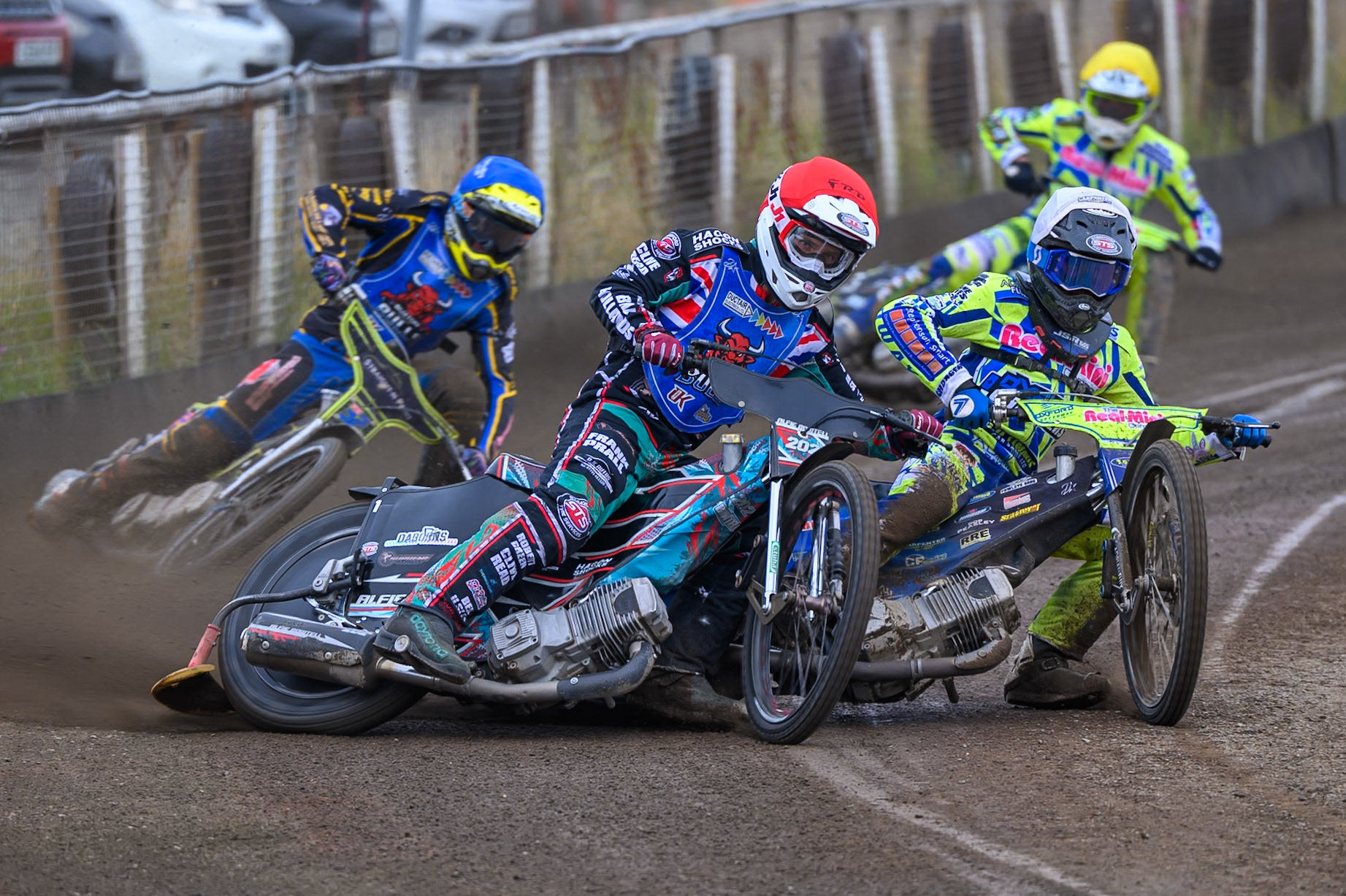 Alfie Bowtell of Buxton Bulls in Red rides outside Jody Scott of Oxford Chargers in White withBen Whalley, Guest Rider for Buxton Bulls in Blue  and Darryl Ritchings of Oxford Chargers in Yellow behind during the WSRA National Development League match between Buxton Bulls and Oxford Chargers at Hi-Edge Speedway, Buxton on Sunday 2nd August 2026. (Photo: Ian Charles | MI News)
