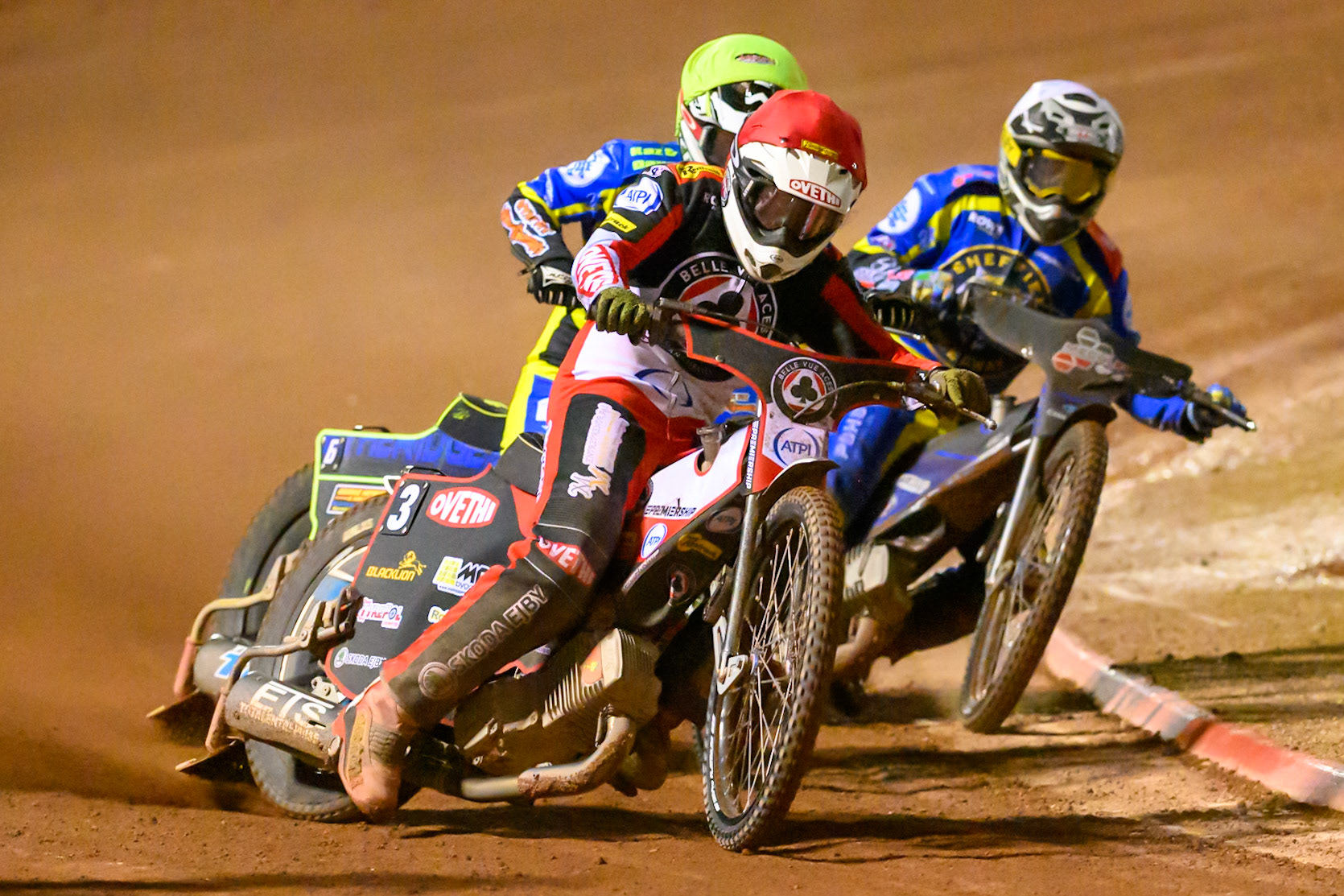 Peter Kildemand of Belle Vue Aces  forces his way past Jye Etheridge of Sheffield Tigers   in Yellow and Josh Pickering of Sheffield Tigers    in White during the Knockout Cup, Northern Section match between Belle Vue Aces and Sheffield Tigers at the National Speedway Stadium, Manchester on Monday 30th March 2026. (Photo: Ian Charles | MI News)