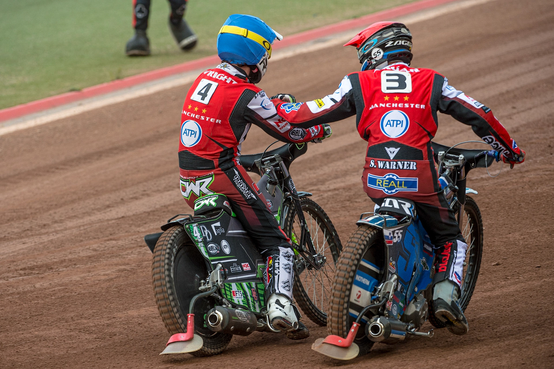 MANCHESTER, UK. JUN 13TH Charles Wright  (Blue) and Matej Zagar  congratulate each other on their maximum heat win during the SGB Premiership match between Belle Vue Aces and Wolverhampton  Wolves at the National Speedway Stadium, Manchester on Monday 13th June 2022. (Credit: Ian Charles | MI News)