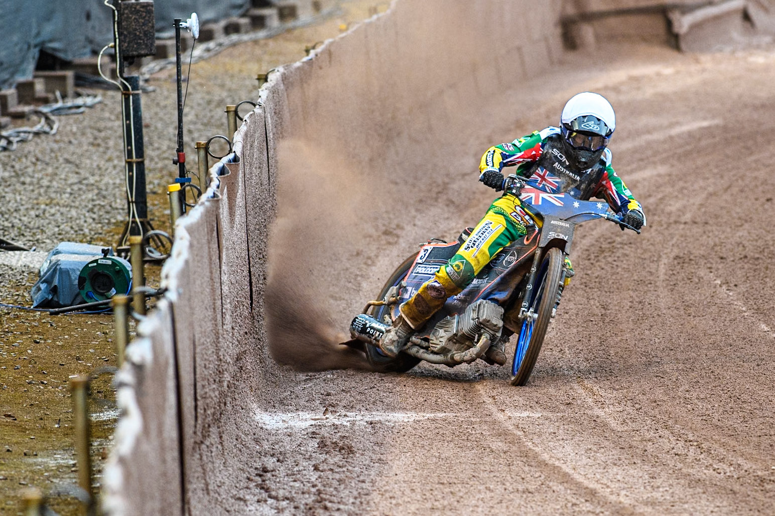 Brady Kurtz of Australia gets some drive from the dirt line at the safety fence during the Monster Energy FIM Speedway of Nation Semi Final 2 at the National Speedway Stadium, Manchester on Wednesday 10th July 2024. (Photo: Ian Charles | MI News)