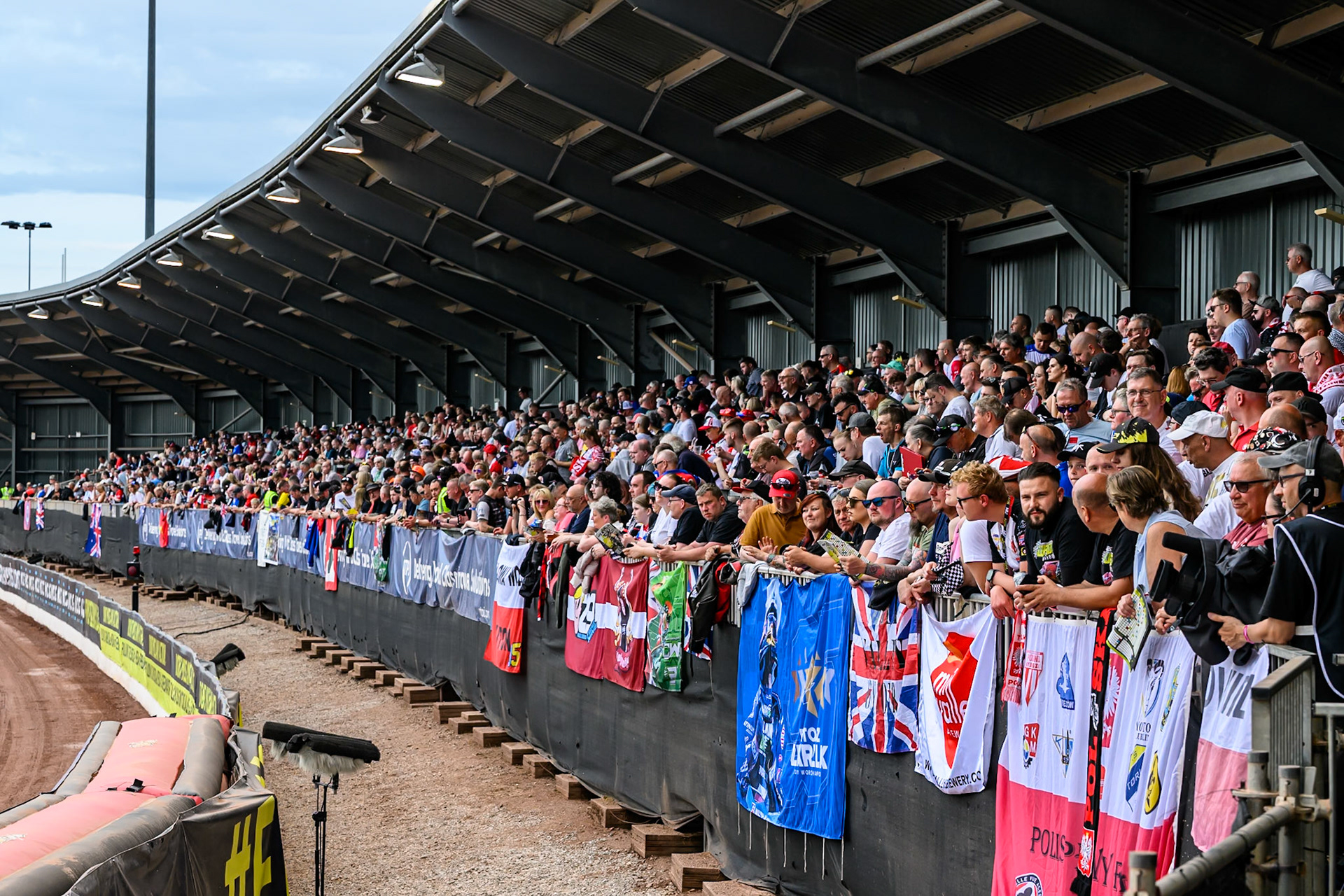 The packed South Stand during the ATPI FIM Speedway Grand Prix Round 4 at the National Speedway Stadium, Manchester, on Friday 13th June 2025. (Photo: Ian Charles | MI News)