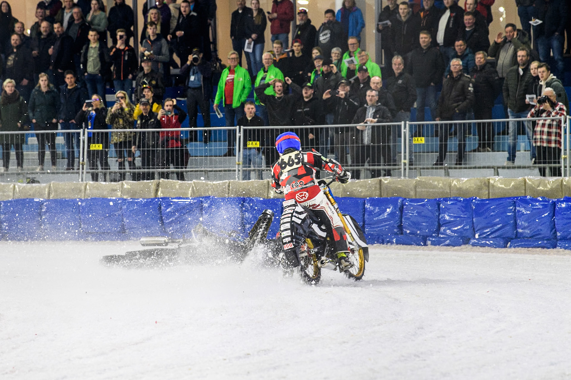 Finland's Aki Ala-Riihimäki (66) in White spins off leaving Austria's Charly Ebner (665) in Blue with nowhere to go during the FIM Ice Speedway Gladiators World Championship Final 4 at Ice Rink Thialf, Heerenveen on Sunday 7th April 2024. (Photo: Ian Charles | MI News)