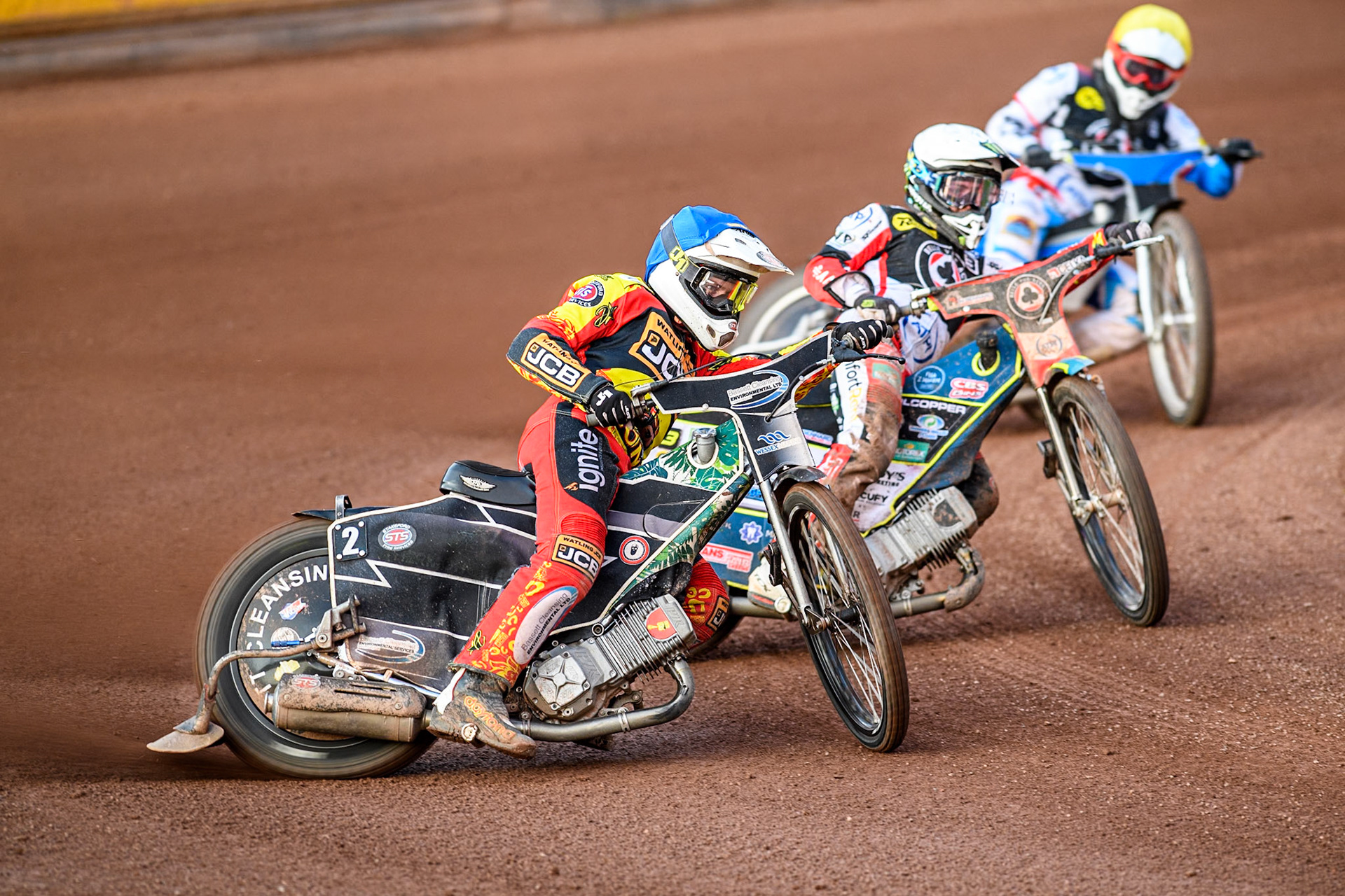 Leicester Lions' Richard Lawson in Blue leading Belle Vue Aces' Jaimon Lidsey in White and Belle Vue Aces' Antti Vuolas in Yellow during the Rowe Motor Oil Premiership match between Leicester Lions and Belle Vue Aces at the Pidcock Motorcycles Arena, Leicester on Thursday 25th July 2024. (Photo: Ian Charles | MI News)