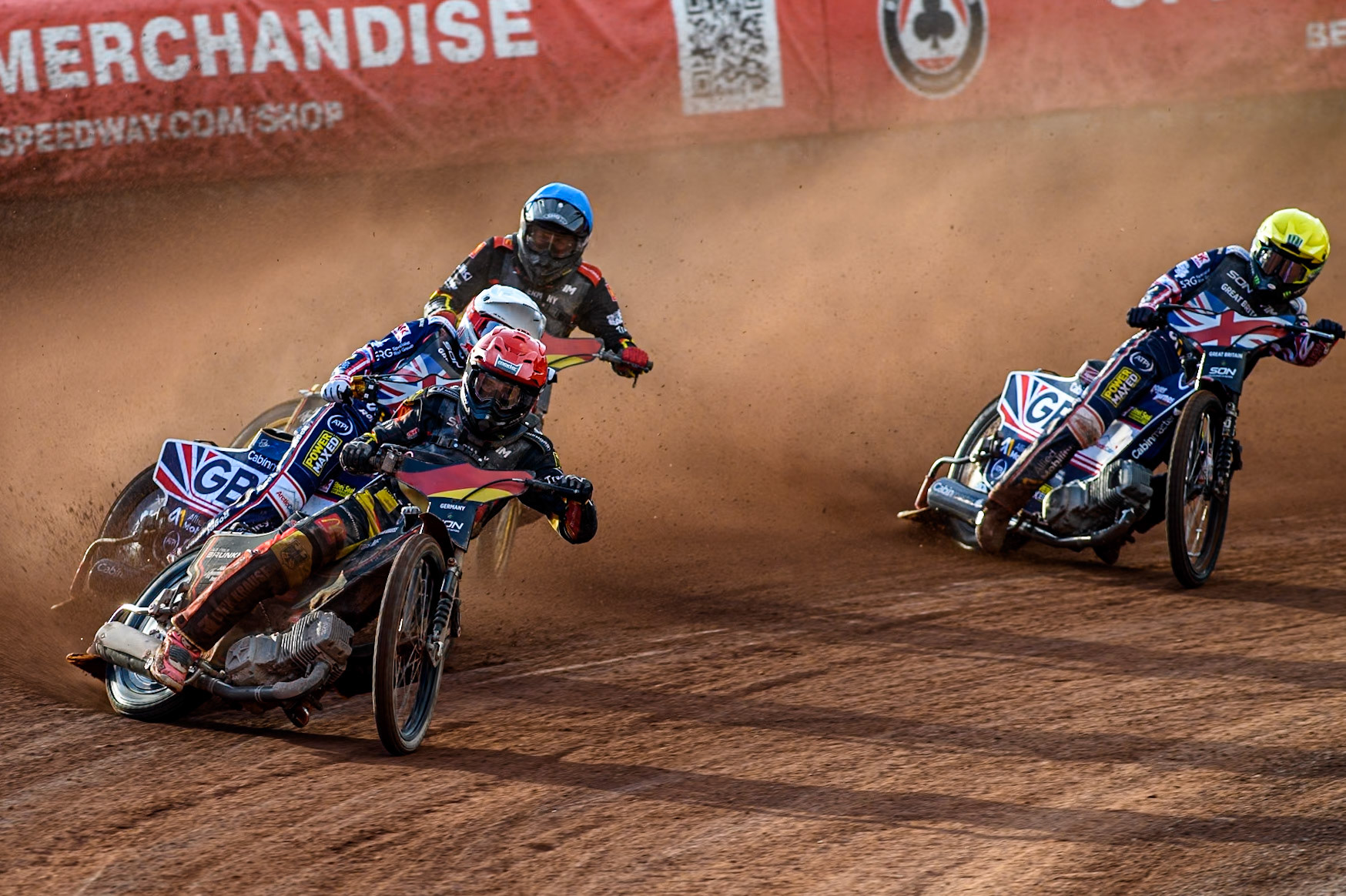 GERMANY v GREAT BRITAIN: Kai Huckenbeck of Germany in Red leading Robert Lambert of Great Britain in White, Norick Blödorn of Germany in Blue and Dan Bewley of Great Britain in Yellow during the Monster Energy FIM Speedway of Nation Final at the National Speedway Stadium, Manchester on Saturday 13th July 2024. (Photo: Ian Charles | MI News)
