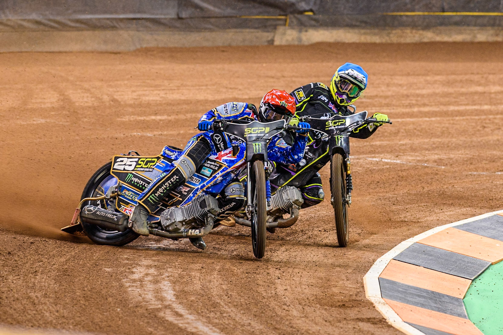 Jack Holder (25) of Australia in Red leading Tom Brennan (16) Wild card rider of Great Britain in Blue during the FIM Speedway Grand Prix of Great Britain at The Principality Stadium, Cardiff on Saturday 17th August 2024. (Photo: Ian Charles | MI News)