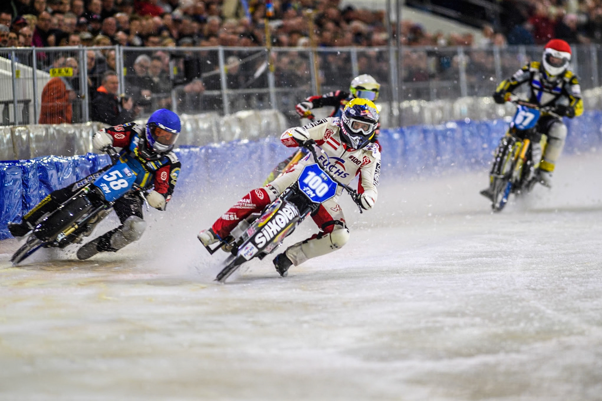 Austria's Franz Zorn (100) in Yellow rides inside Sweden's Stefan Svensson (58) in Blue with Netherlands' Jasper Iwema (800) in White and Finland's Heikki Huusko (67) in Red behind  during the FIM Ice Speedway Gladiators World Championship Final 4 at Ice Rink Thialf, Heerenveen on Sunday 7th April 2024. (Photo: Ian Charles | MI News)