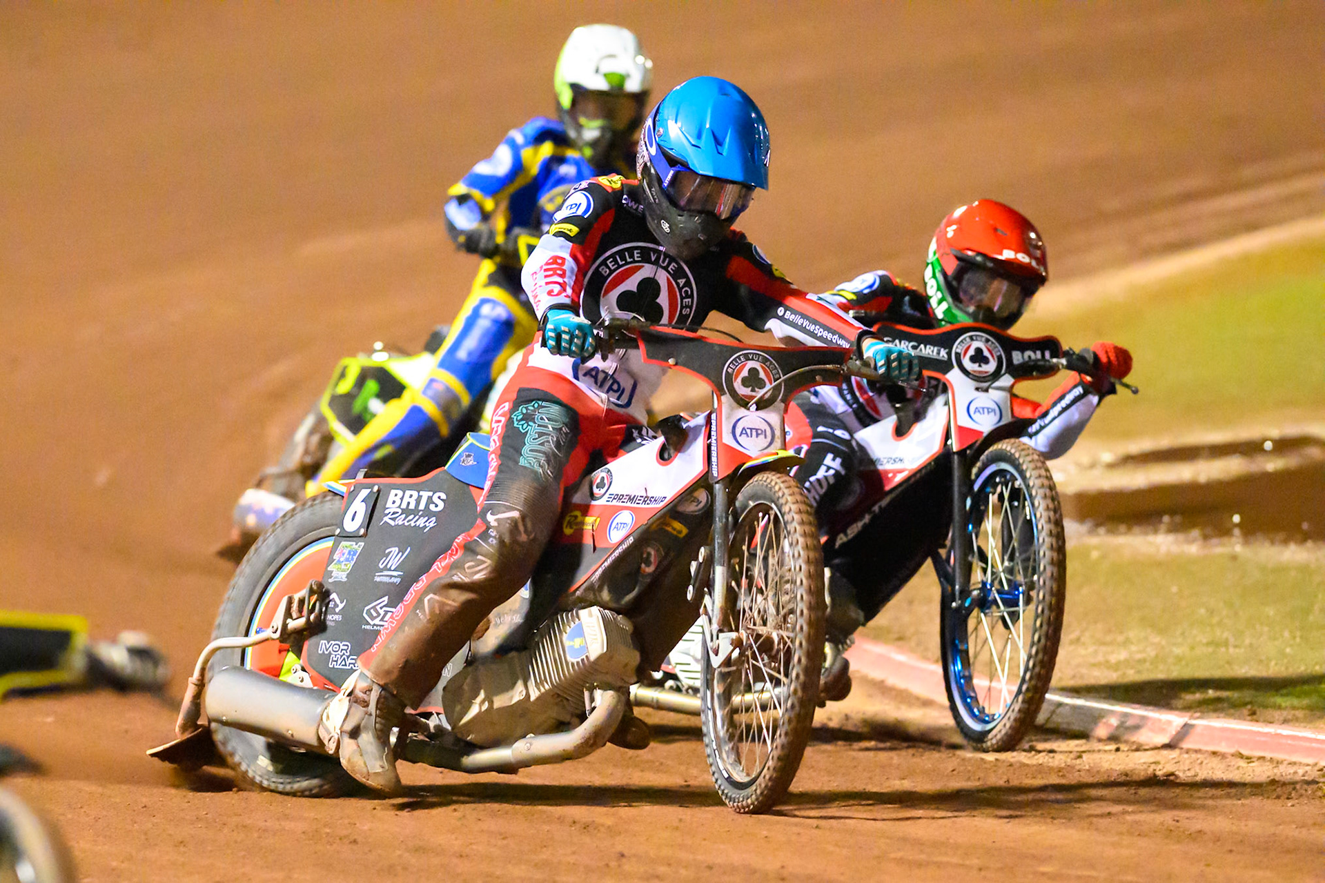 Tate Zischke of Belle Vue Aces   in Blue rides outside Brady Kurtz of Belle Vue Aces  in Red with Josh Pickering of Sheffield Tigers   in White behind during the Knockout Cup, Northern Section match between Belle Vue Aces and Sheffield Tigers at the National Speedway Stadium, Manchester on Monday 30th March 2026. (Photo: Ian Charles | MI News)