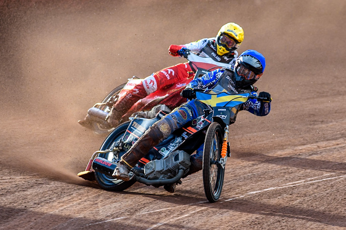 Jacob Thorssell of Sweden in Blue leading Dominik Kubera of Poland in Yellow during the Monster Energy FIM Speedway of Nation Final at the National Speedway Stadium, Manchester on Saturday 13th July 2024. (Photo: Ian Charles | MI News)