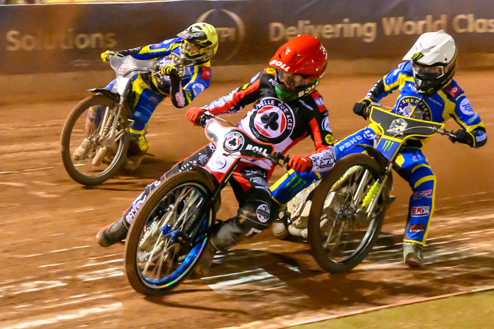Brady Kurtz of Belle Vue Aces in Red leading Jack Holder of Sheffield Tigers  in White and Josh Pickering of Sheffield Tigers    in Yellow during the Knockout Cup, Northern Section match between Belle Vue Aces and Sheffield Tigers at the National Speedway Stadium, Manchester on Monday 30th March 2026. (Photo: Ian Charles | MI News)